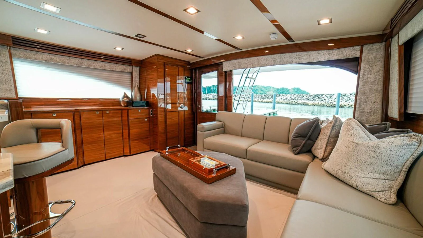 The salon features plush seating and elegant wood finishes, offering a comfortable and stylish space for relaxation. aboard FREE SPOOL Yacht for Sale