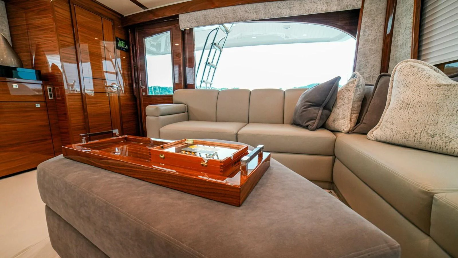 The salon features a luxurious seating area with plush cushions and elegant wooden accents. aboard FREE SPOOL Yacht for Sale