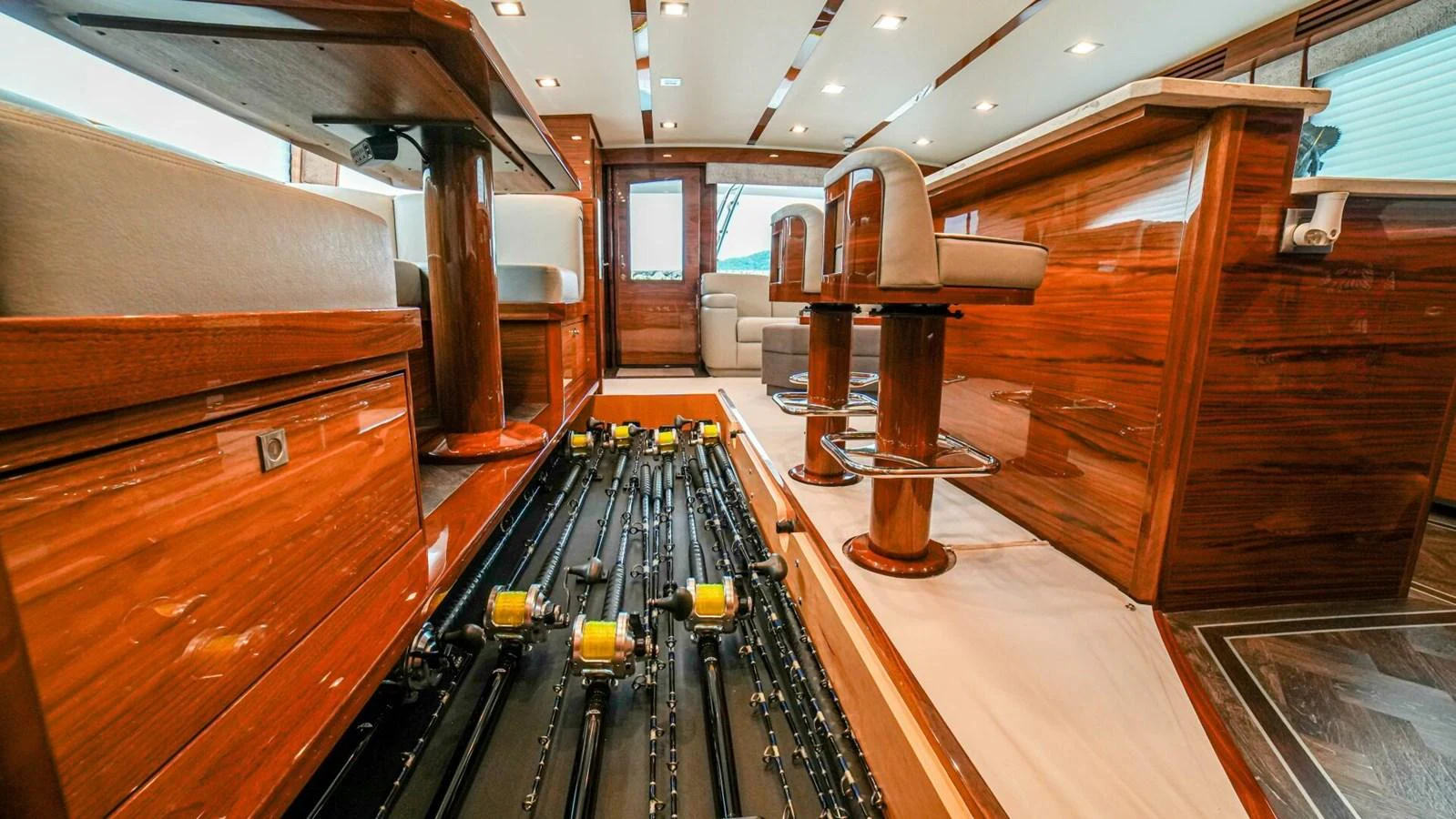The yacht's salon features elegant wooden furnishings and ample seating. aboard FREE SPOOL Yacht for Sale