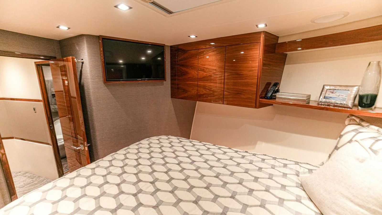 A cozy stateroom featuring a comfortable bed and modern amenities. aboard FREE SPOOL Yacht for Sale