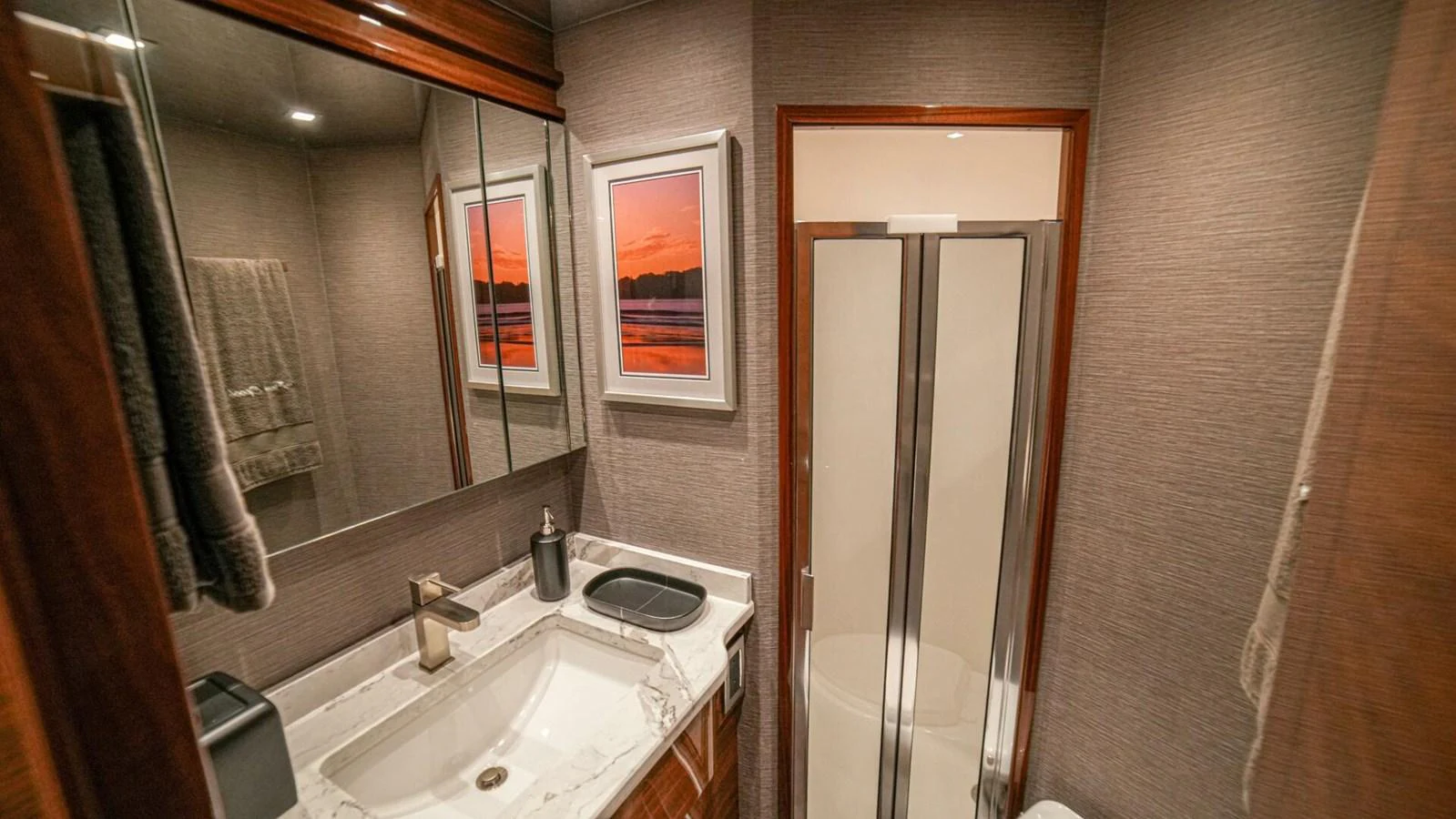 The yacht's bathroom features elegant fixtures and a spacious shower area. aboard FREE SPOOL Yacht for Sale