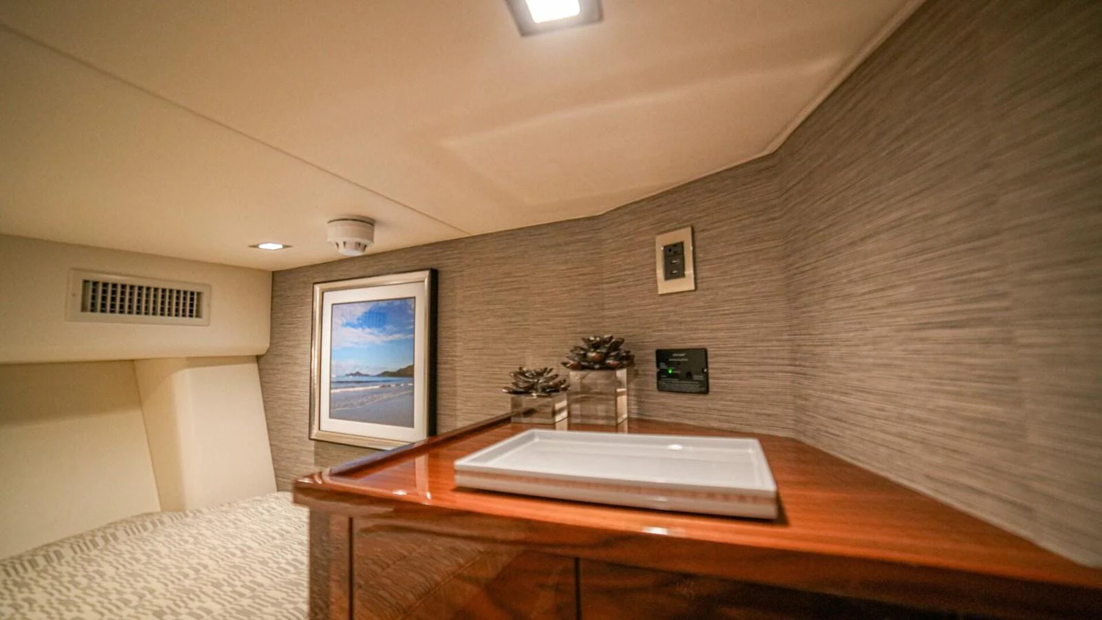 A cozy interior space featuring a wooden countertop and wall art. aboard FREE SPOOL Yacht for Sale