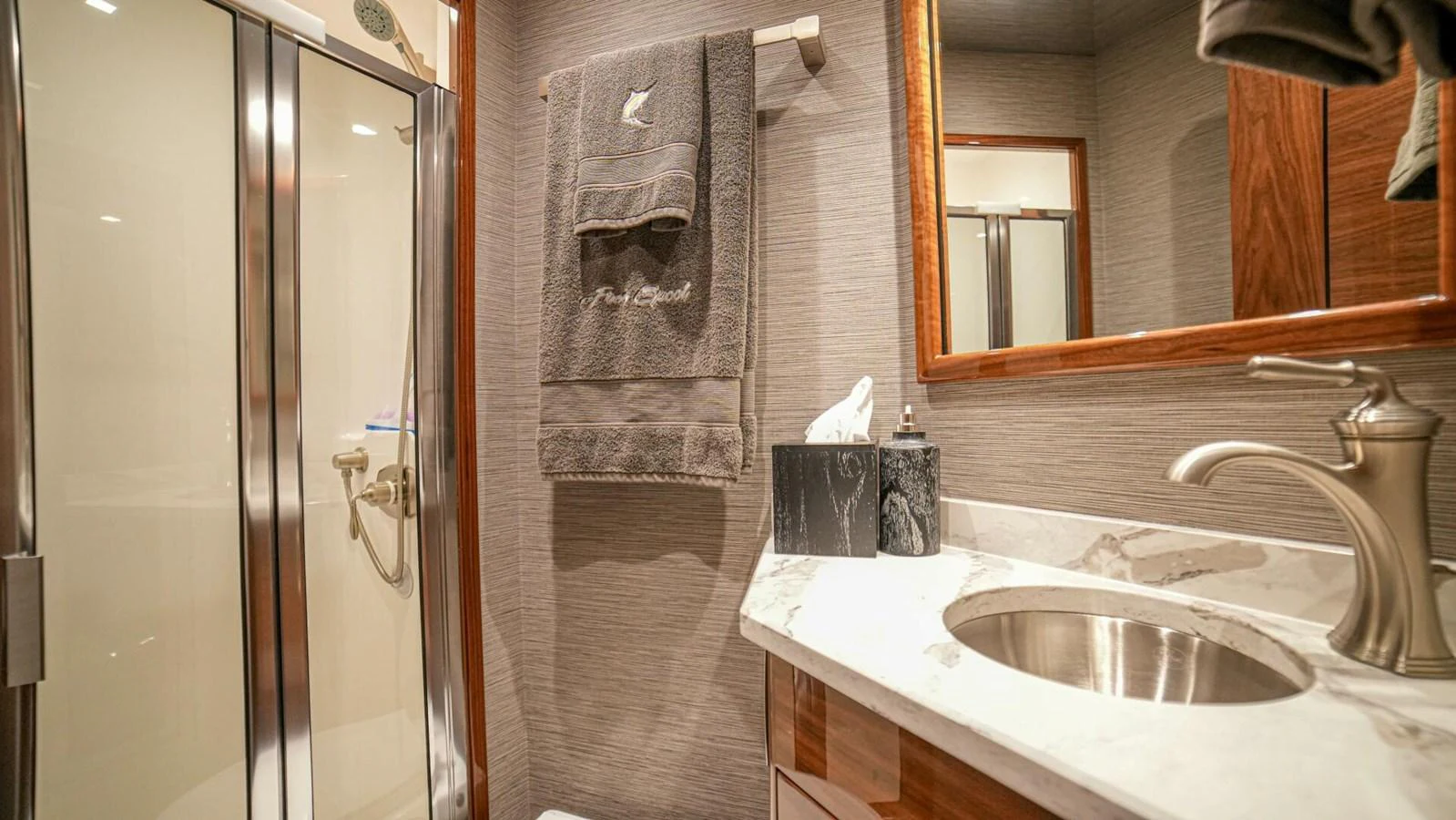 The yacht's bathroom features a sleek design with modern fixtures and luxurious amenities. aboard FREE SPOOL Yacht for Sale