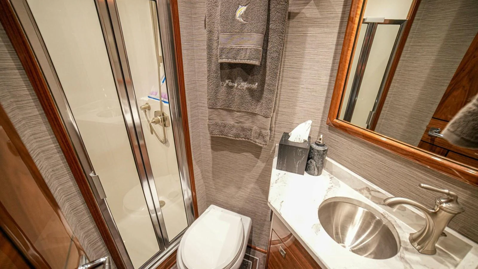 A well-appointed yacht bathroom featuring modern fixtures and elegant finishes. aboard FREE SPOOL Yacht for Sale