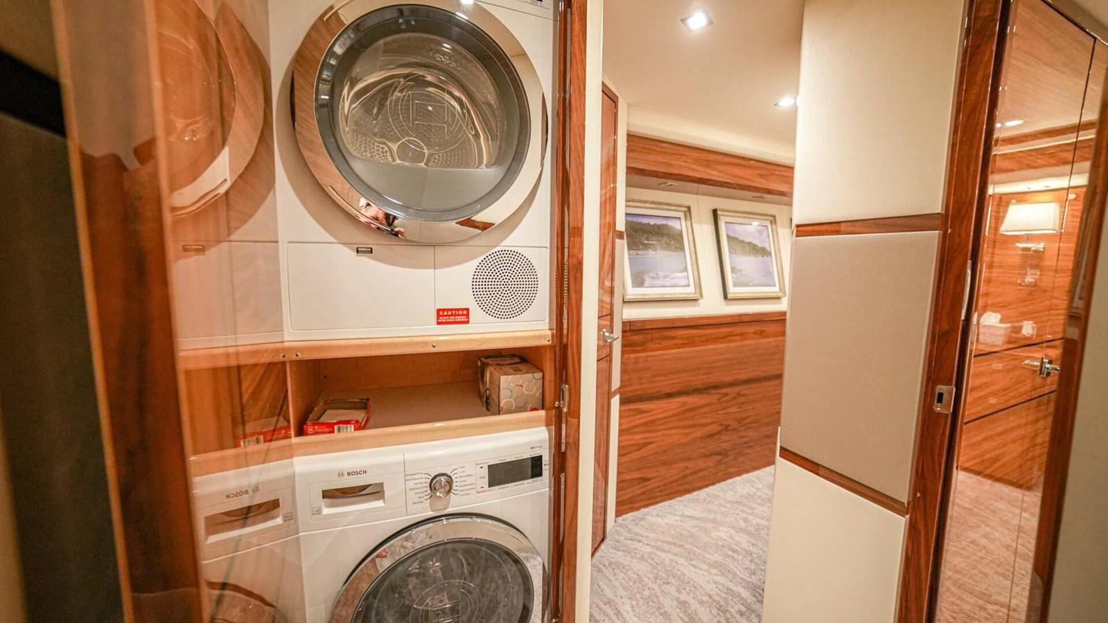 The yacht features a well-equipped laundry room with modern appliances. aboard FREE SPOOL Yacht for Sale