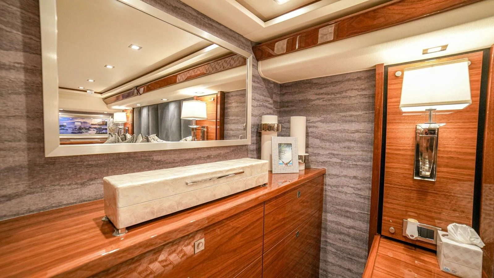 The yacht's interior features elegant wooden cabinetry and modern lighting fixtures. aboard FREE SPOOL Yacht for Sale