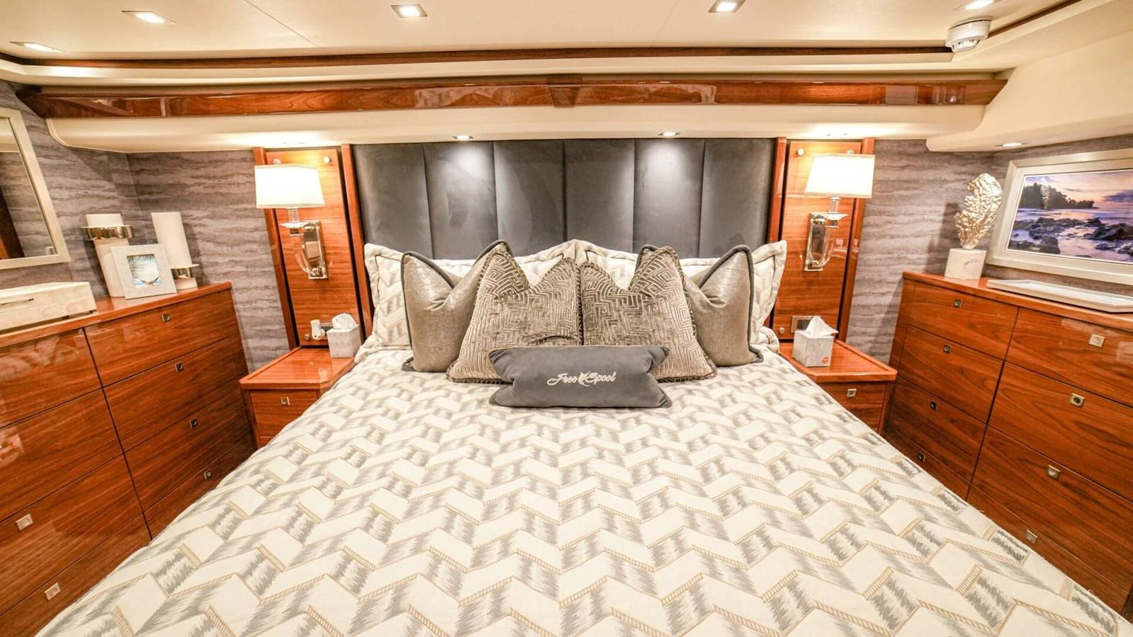 The master stateroom features a luxurious bed with elegant bedding and ample storage space. aboard FREE SPOOL Yacht for Sale