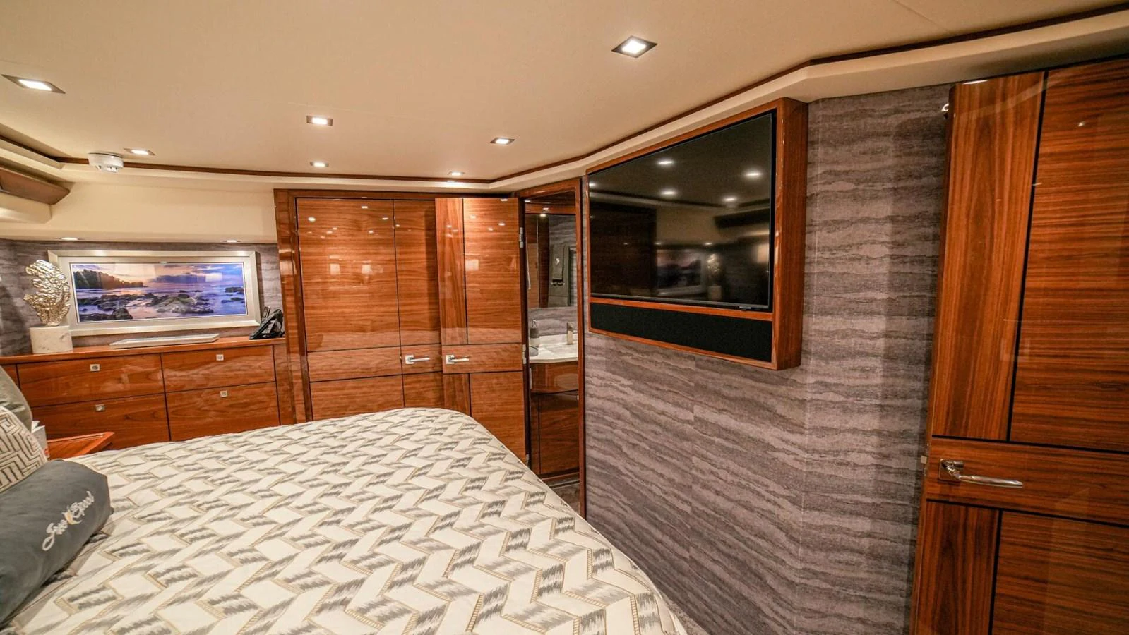 The stateroom features elegant wood paneling and modern amenities for a comfortable stay. aboard FREE SPOOL Yacht for Sale