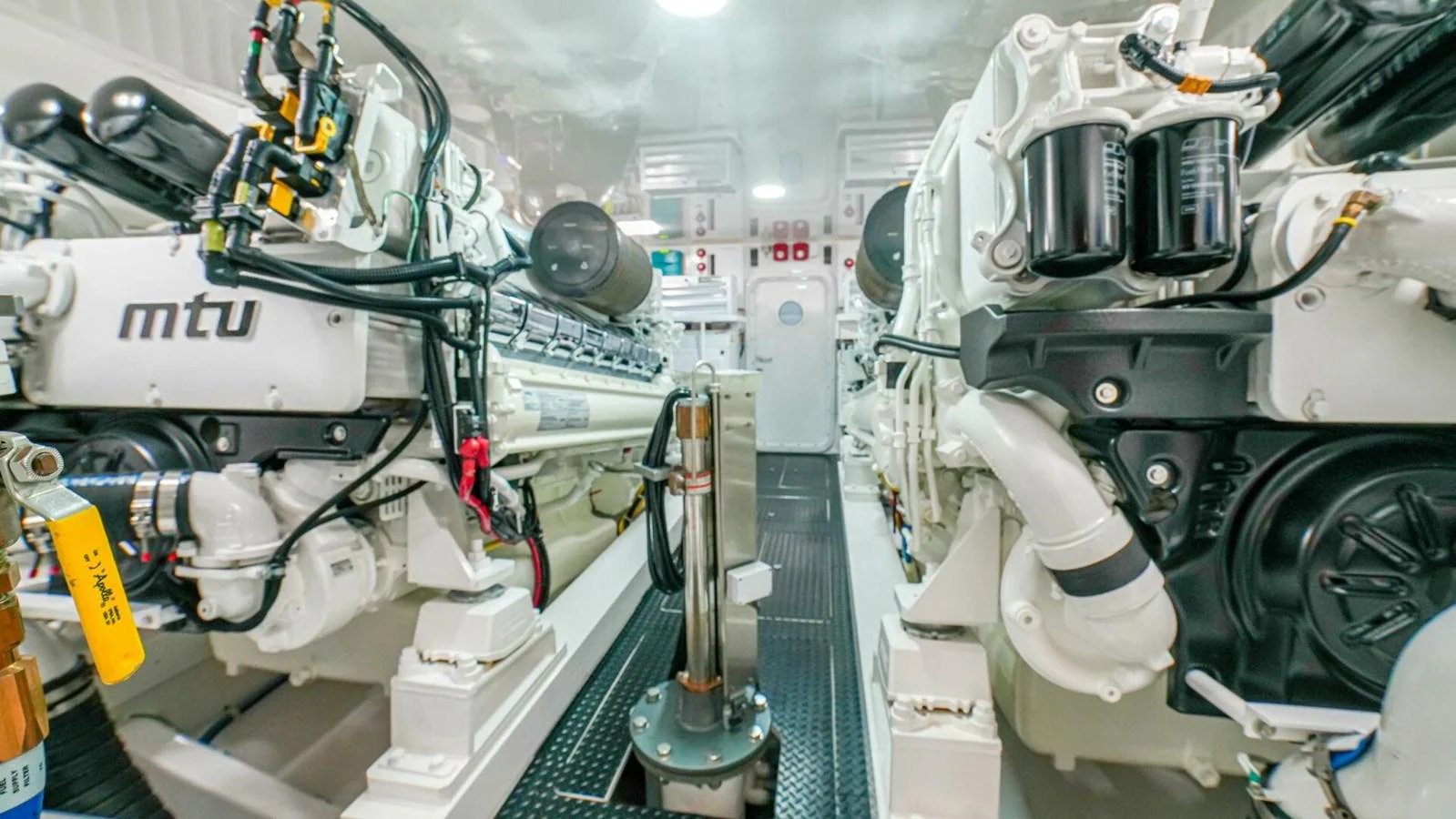 The image showcases the yacht's well-maintained engine room with advanced machinery. aboard FREE SPOOL Yacht for Sale