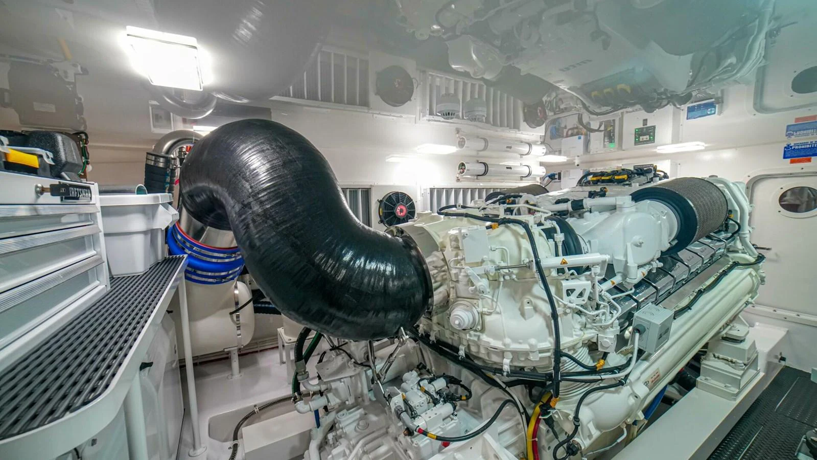 The yacht's engine room showcases powerful machinery and meticulous organization. aboard FREE SPOOL Yacht for Sale