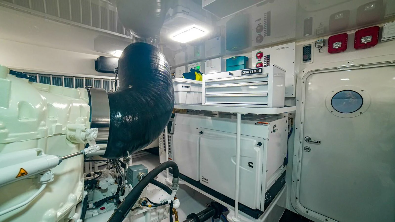 The engine room is equipped with advanced machinery and organized storage solutions. aboard FREE SPOOL Yacht for Sale