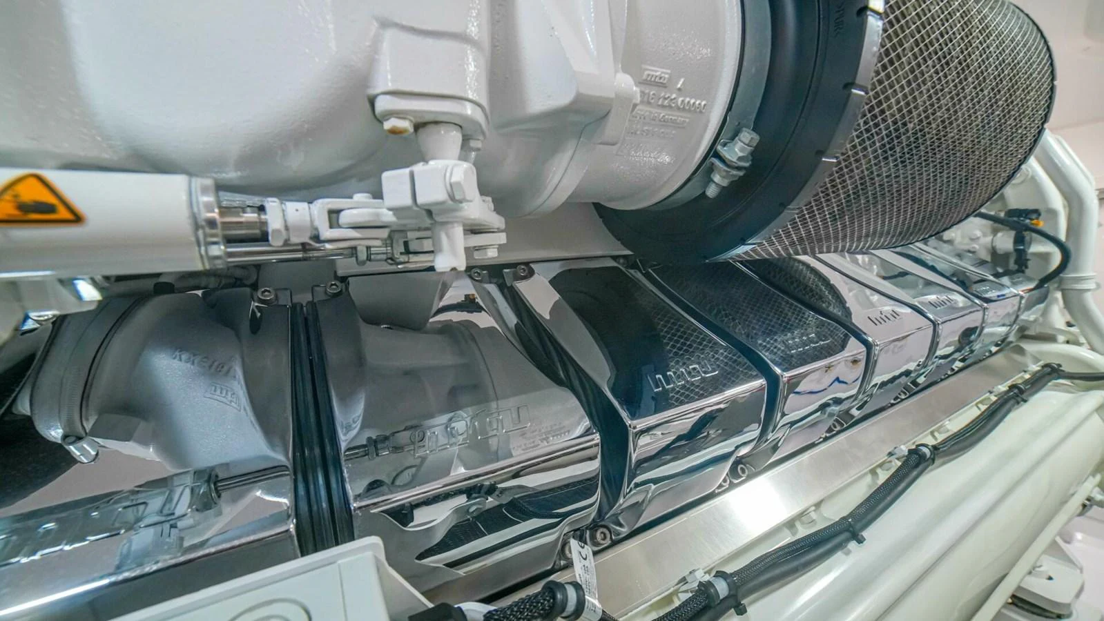 A close-up view of the yacht's engine showcasing its intricate components and engineering. aboard FREE SPOOL Yacht for Sale