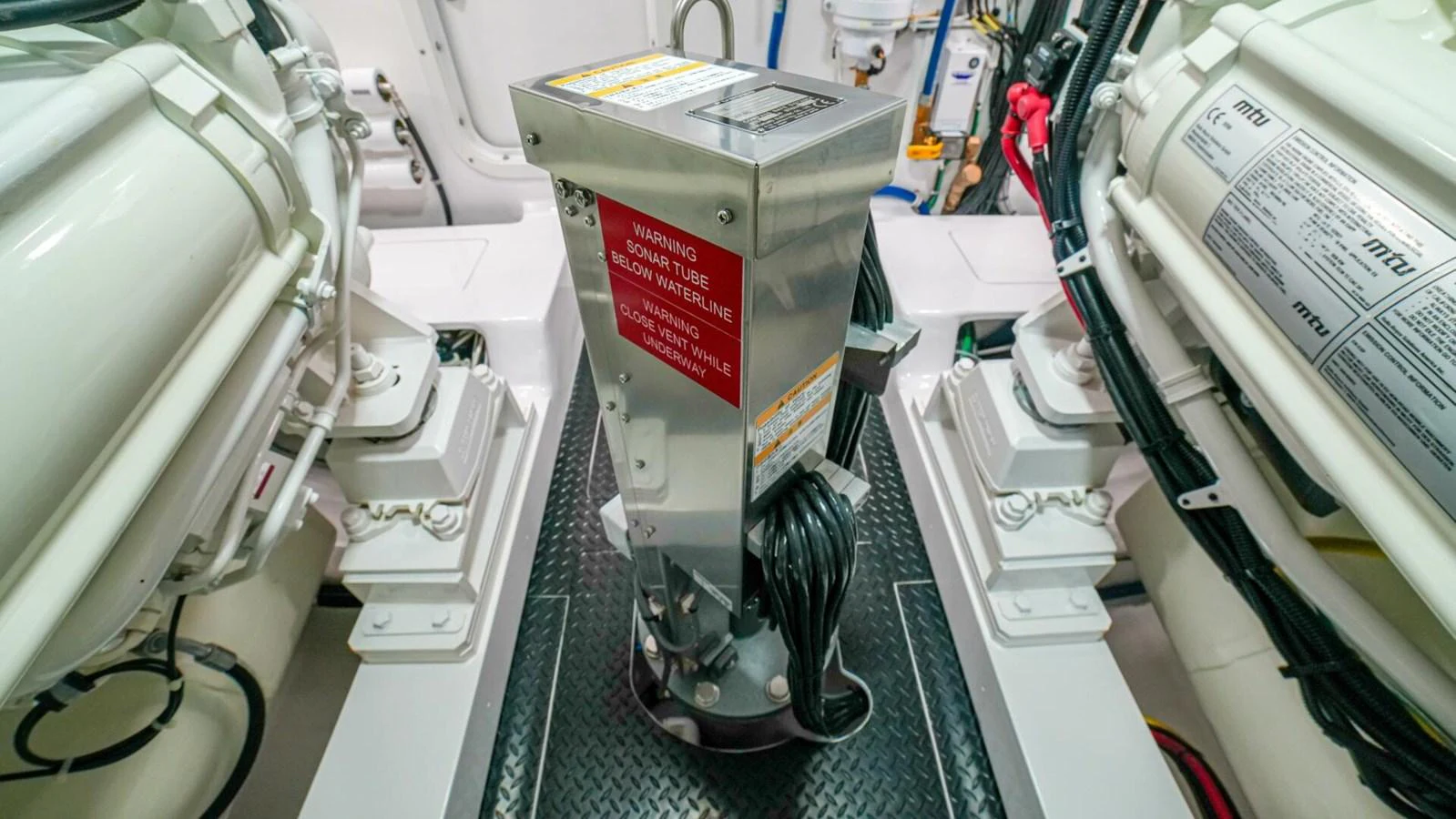 The image showcases the well-maintained engine room of the yacht, highlighting its technical components. aboard FREE SPOOL Yacht for Sale