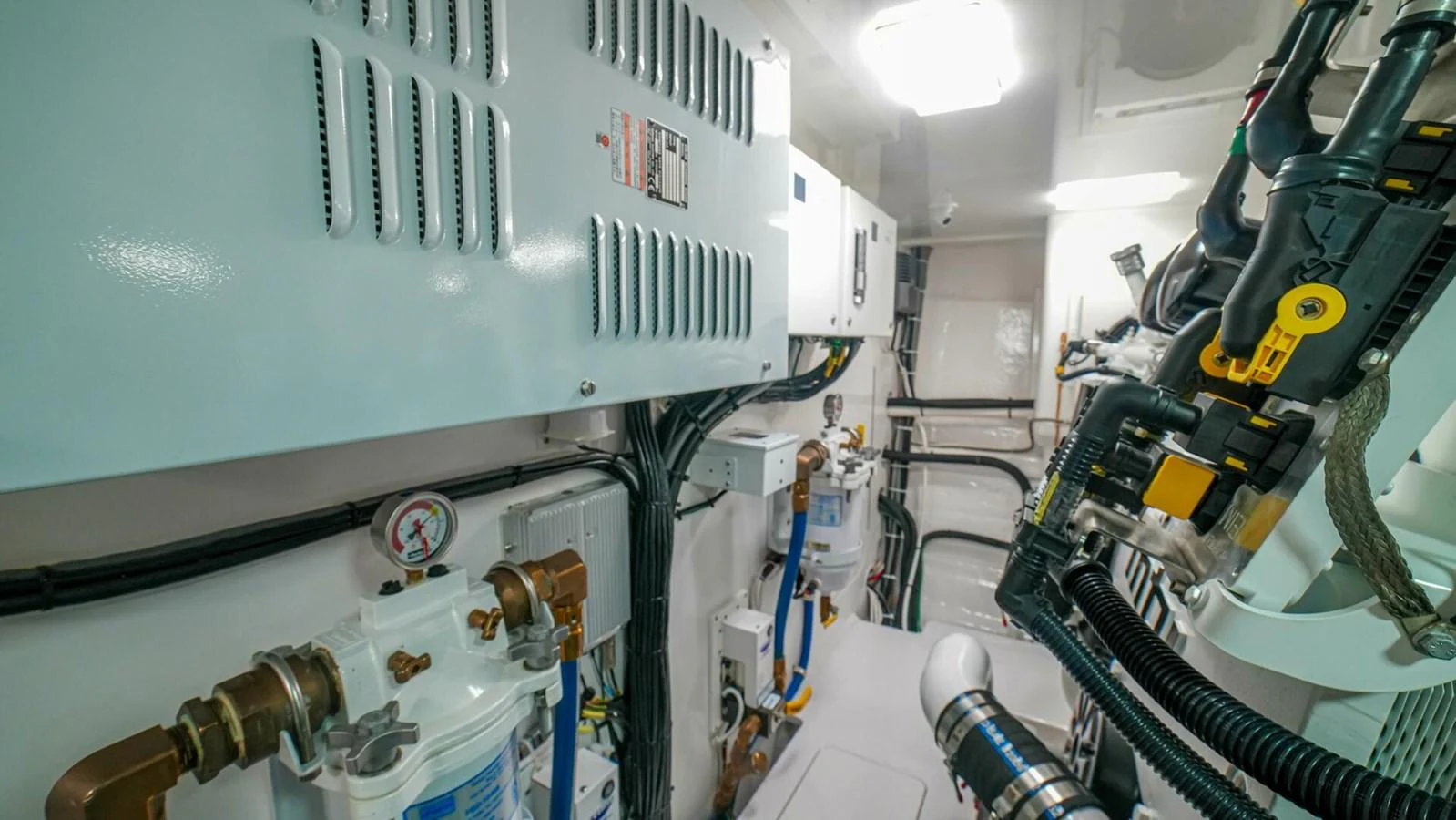 The engine room is meticulously organized with advanced machinery and systems. aboard FREE SPOOL Yacht for Sale