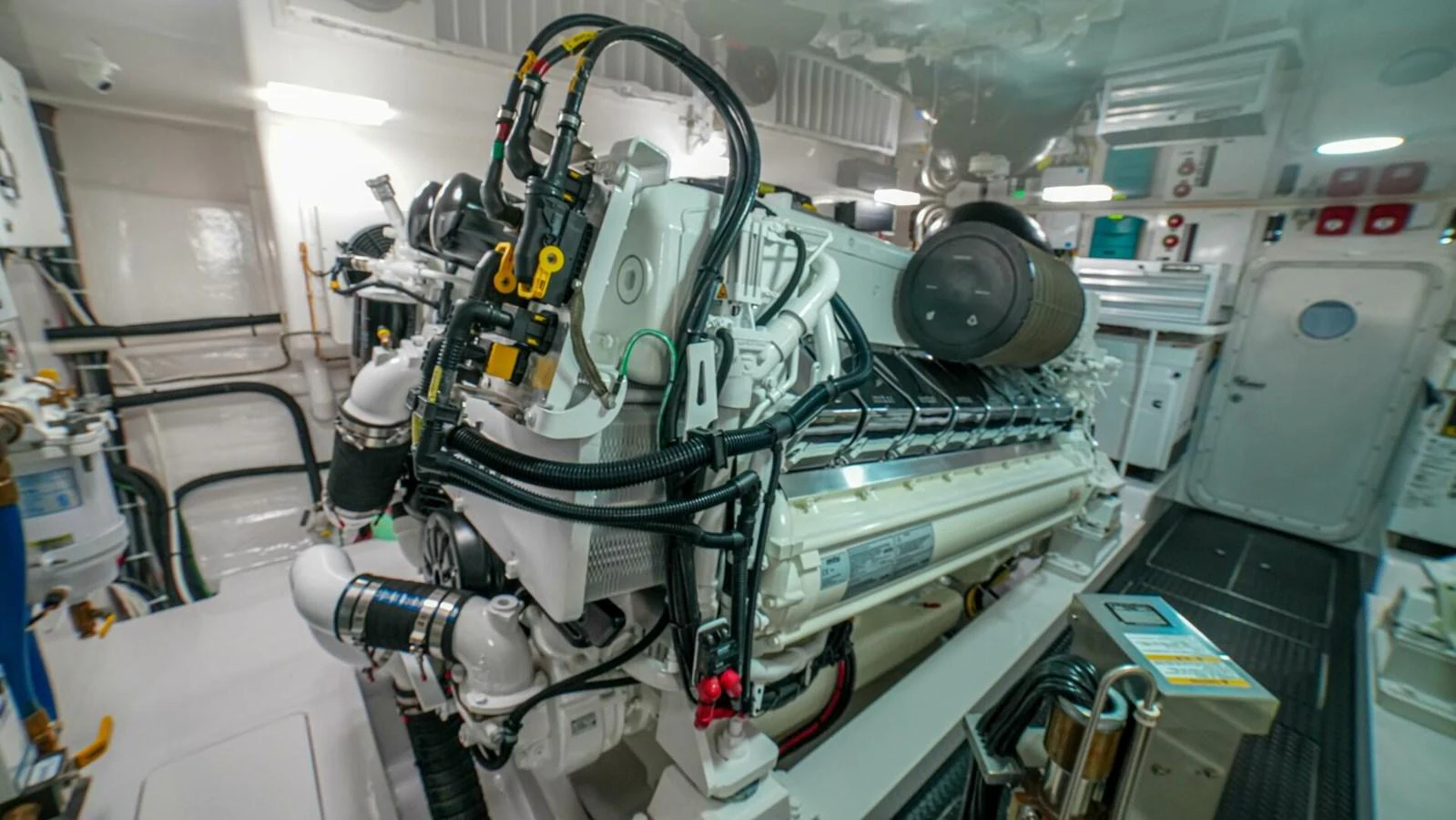 The image showcases the yacht's engine room with detailed machinery and equipment. aboard FREE SPOOL Yacht for Sale
