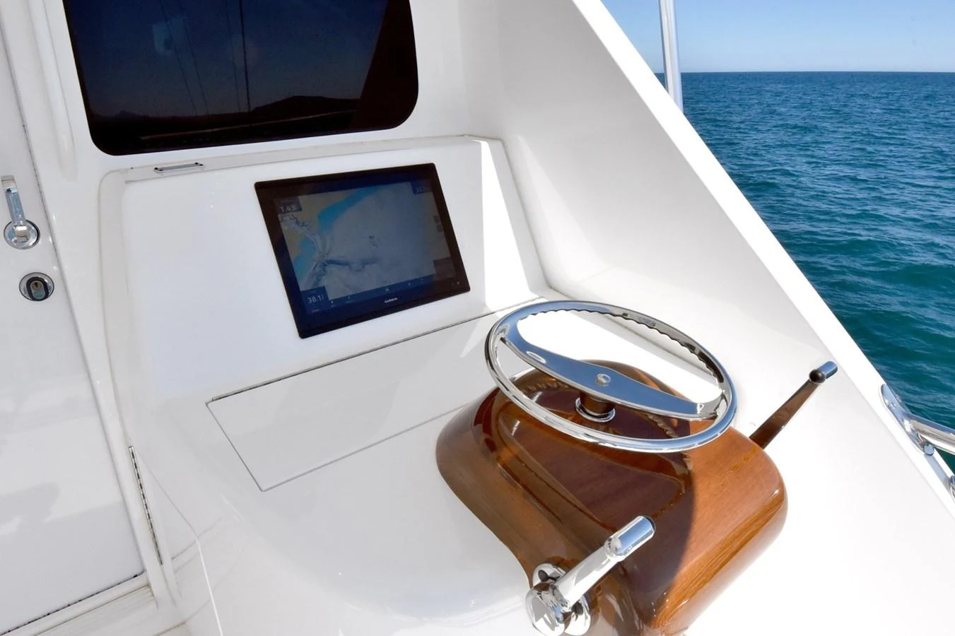 The helm features a sleek design with modern navigation equipment. aboard PRIMETIME Yacht for Sale