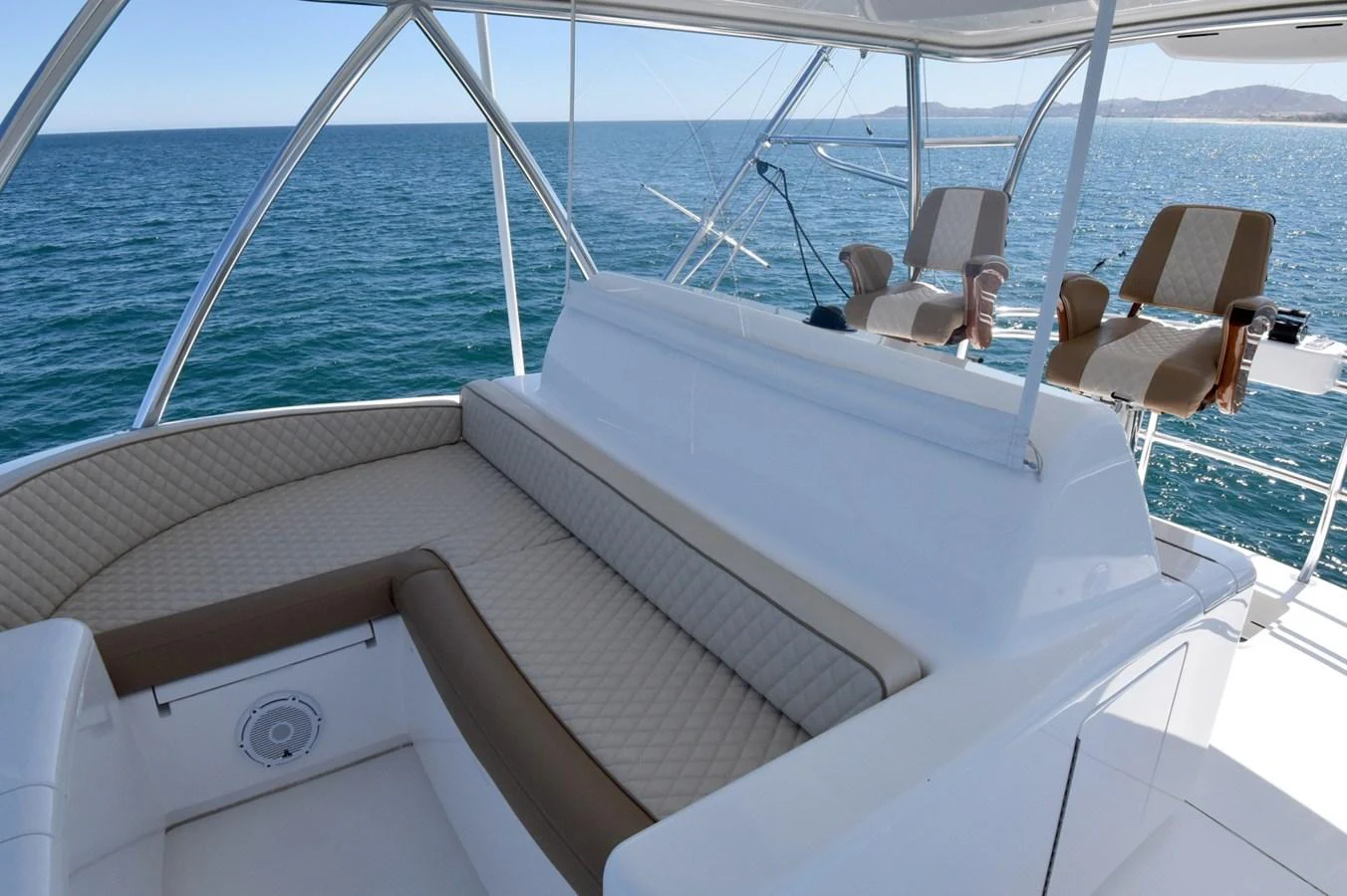 The flybridge offers comfortable seating with panoramic ocean views. aboard PRIMETIME Yacht for Sale