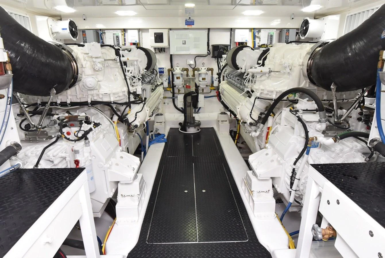 The engine room showcases powerful machinery and a clean, organized layout. aboard PRIMETIME Yacht for Sale