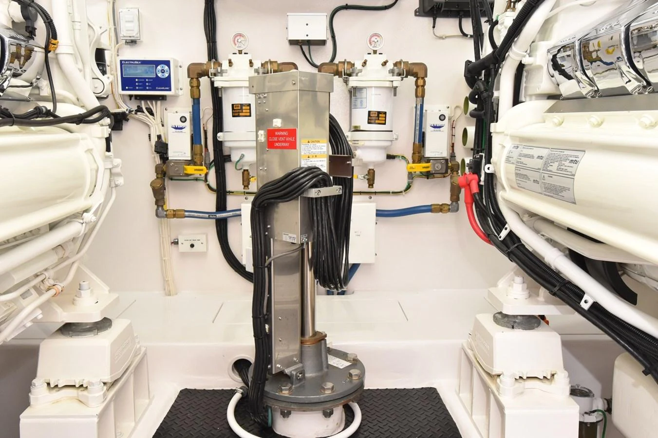 The yacht's engine room showcases advanced machinery and well-organized systems. aboard PRIMETIME Yacht for Sale