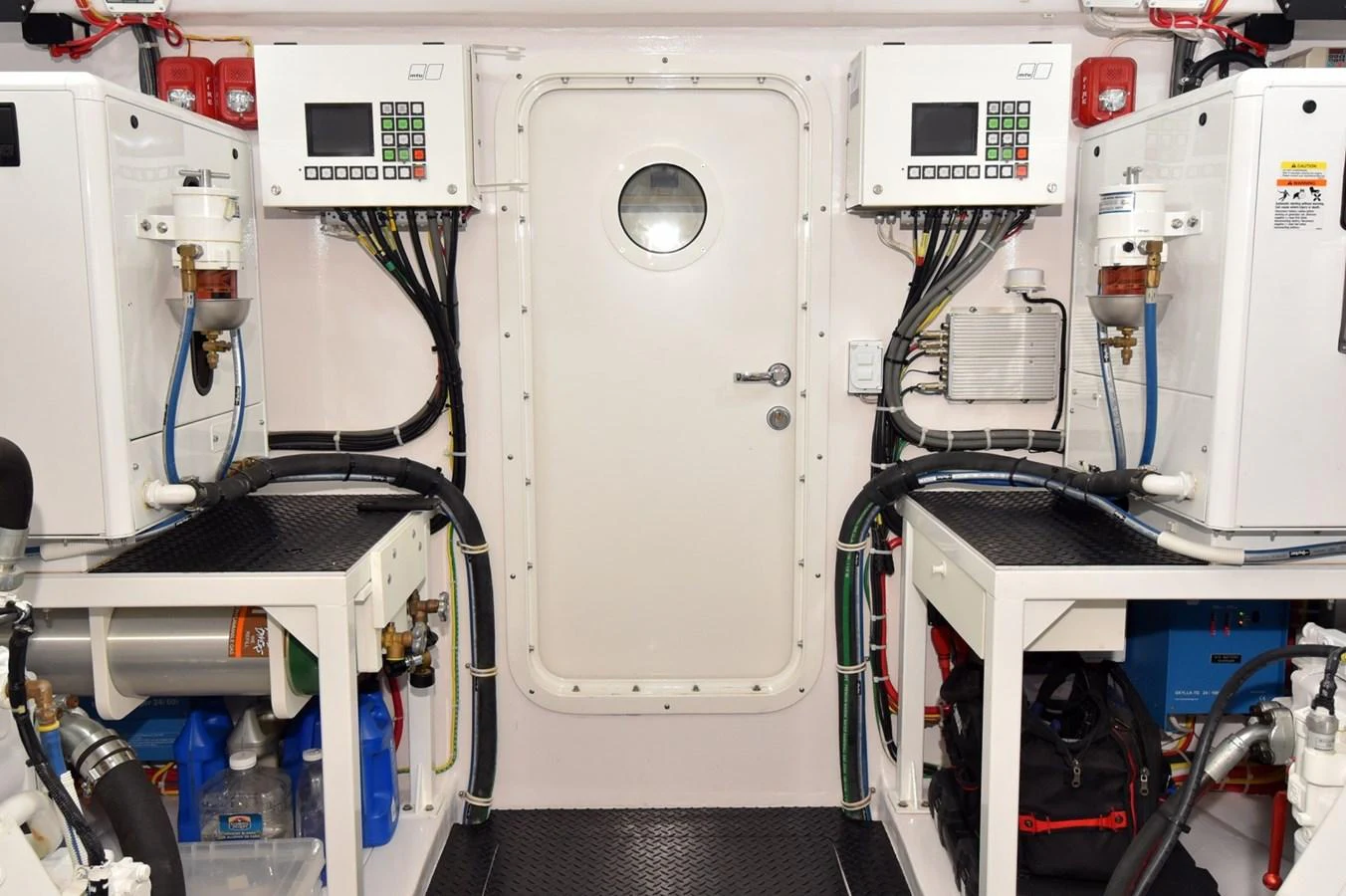 The yacht's engine room is equipped with advanced machinery and control panels. aboard PRIMETIME Yacht for Sale