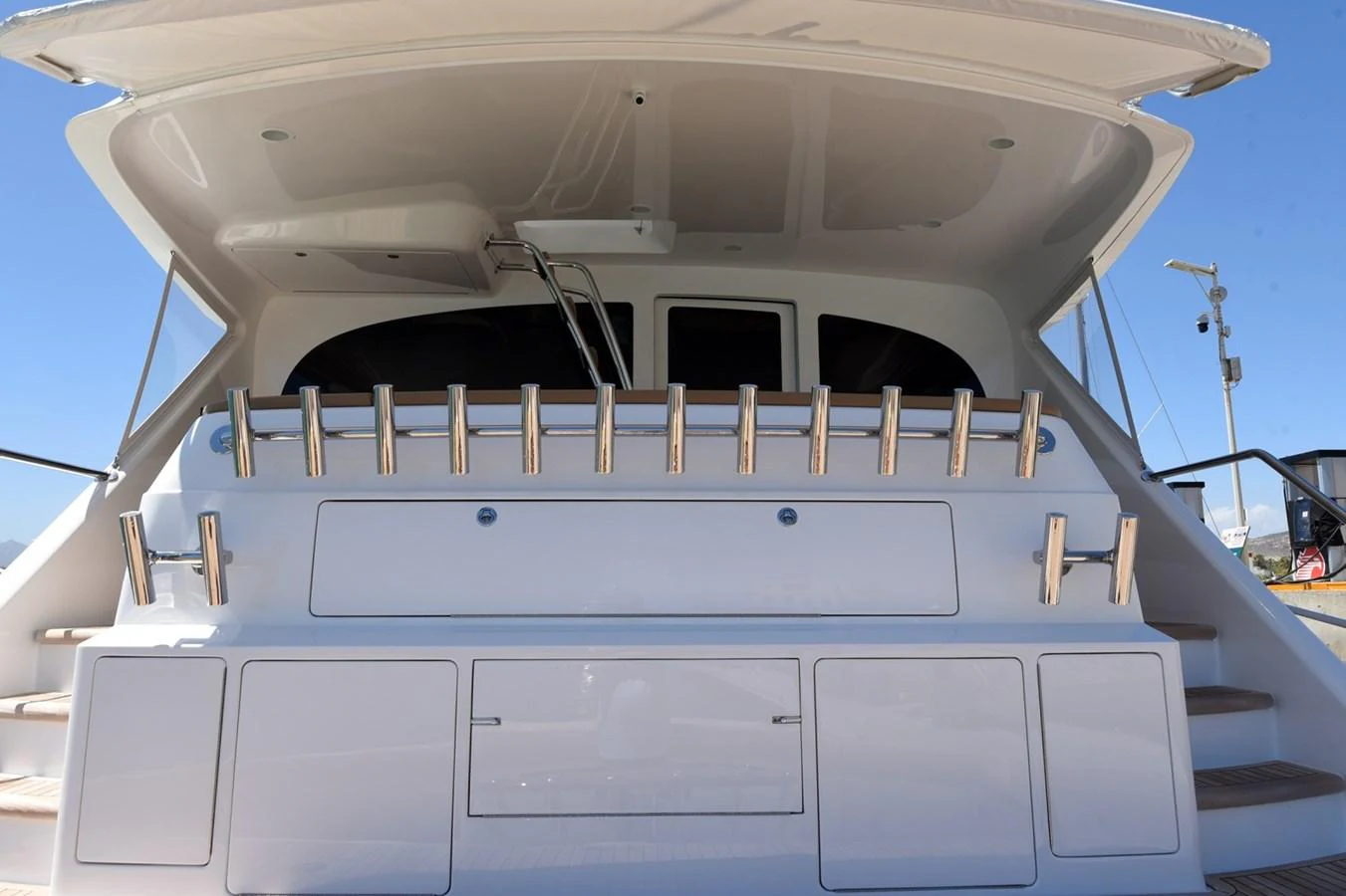 The aft deck of the yacht features a clean and modern design with ample storage space. aboard PRIMETIME Yacht for Sale