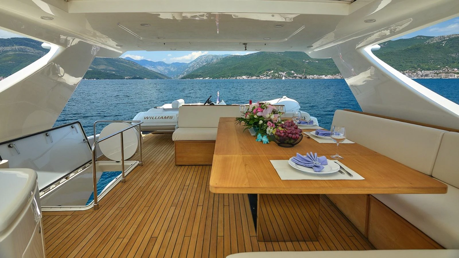 The aft deck features a stylish dining area with scenic views of the surrounding waters. aboard GANS Yacht for Sale