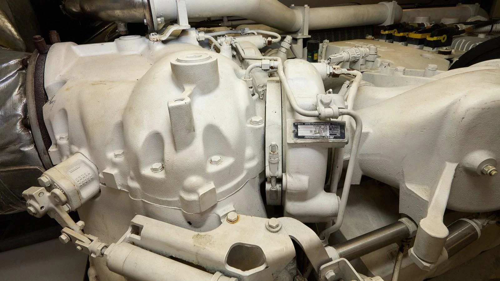 The image showcases the intricate machinery within the yacht's engine room. aboard GANS Yacht for Sale