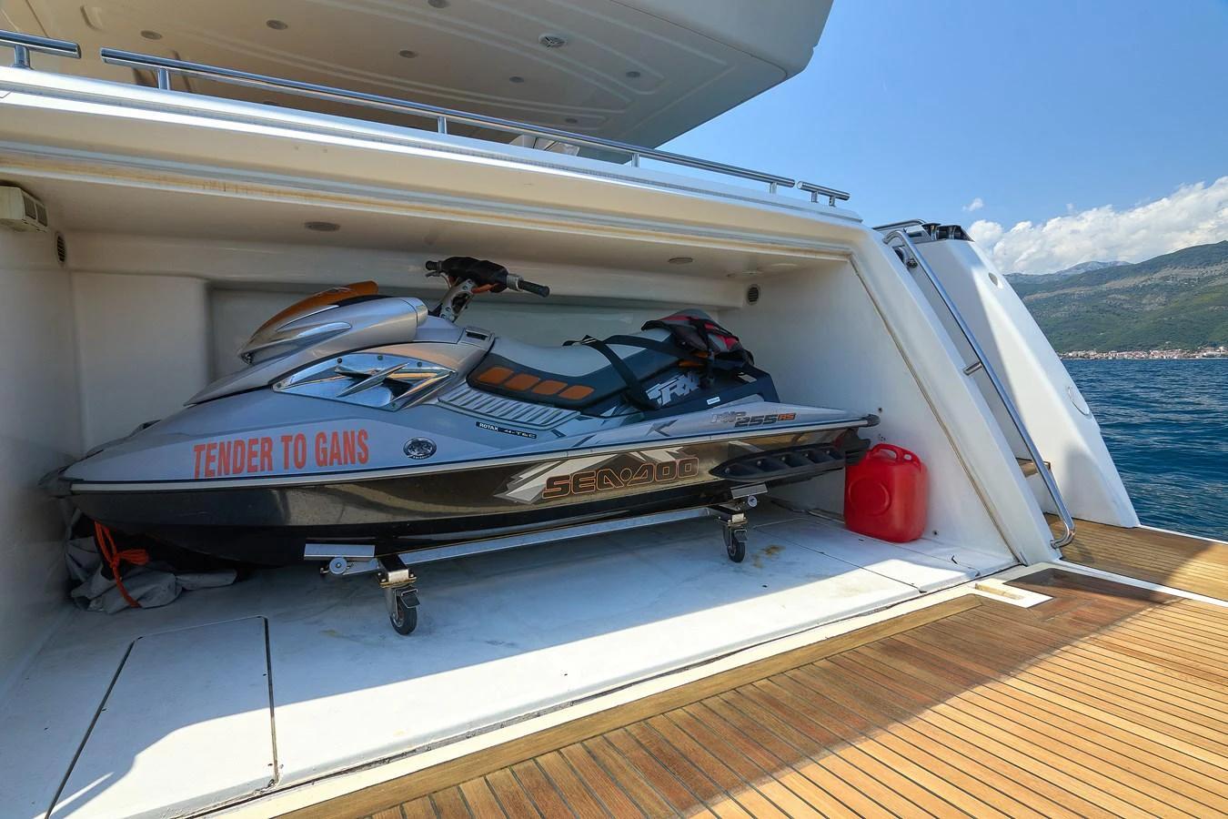 The yacht features a well-equipped tender garage with a sleek jet ski ready for adventure. aboard GANS Yacht for Sale
