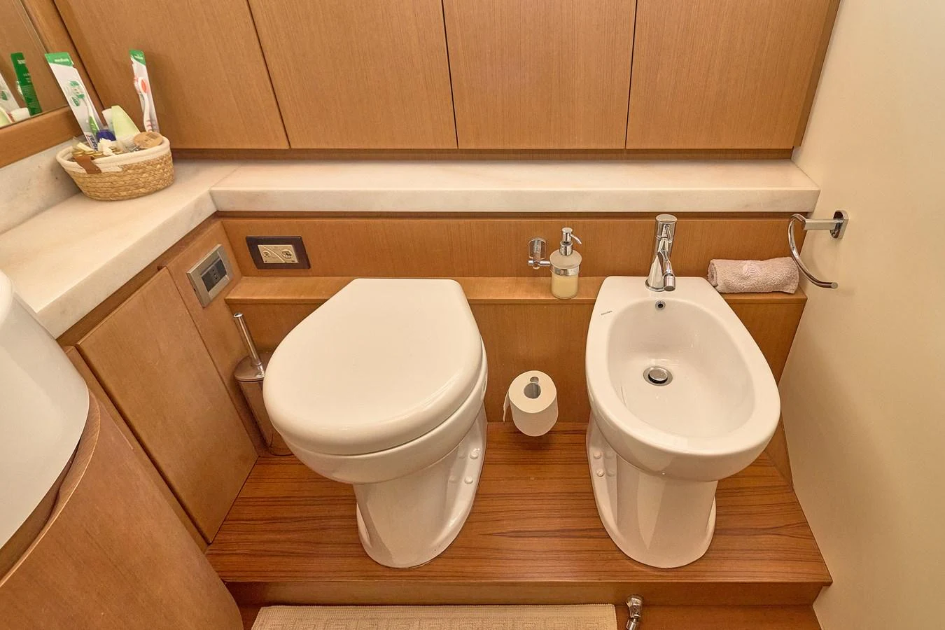 A well-appointed yacht bathroom with modern fixtures and wooden cabinetry. aboard GANS Yacht for Sale