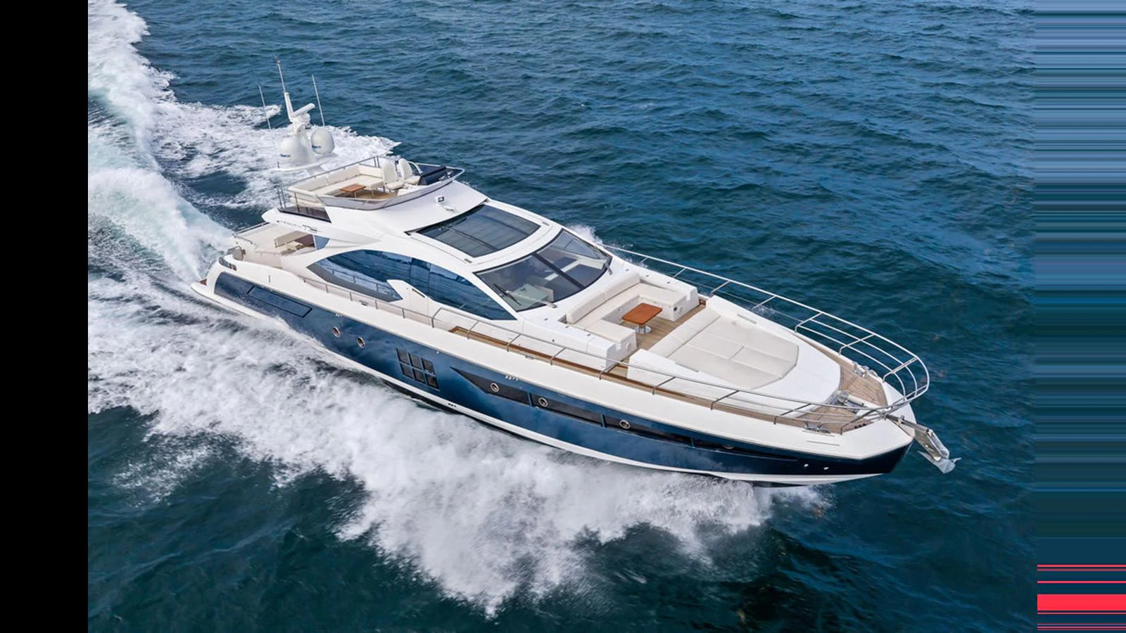 A sleek yacht cruises swiftly through the water, showcasing its modern design and spacious deck. aboard VILLAGGIO Yacht for Sale