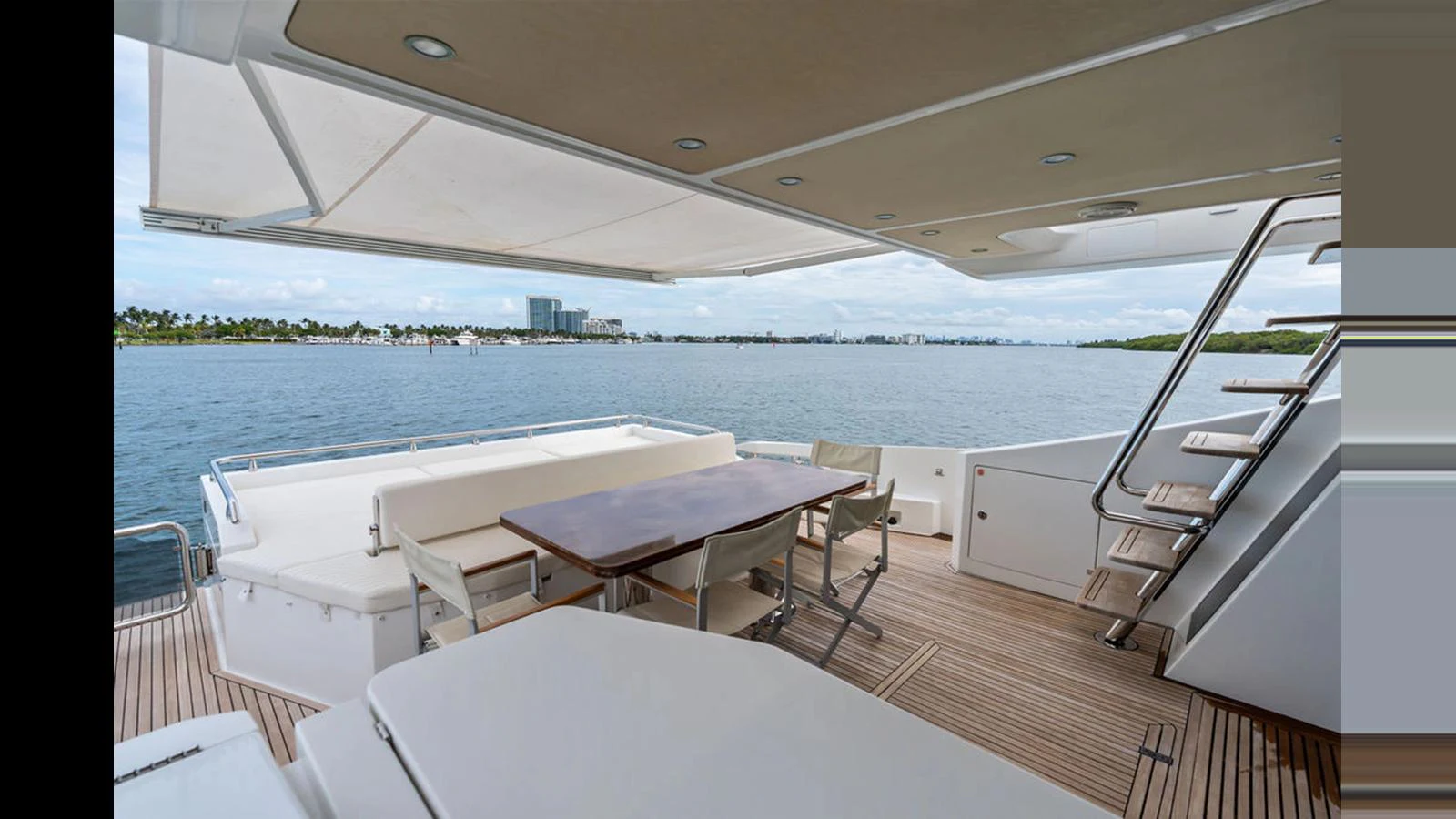 The aft deck offers a spacious and inviting area for alfresco dining and relaxation with stunning water views. aboard VILLAGGIO Yacht for Sale