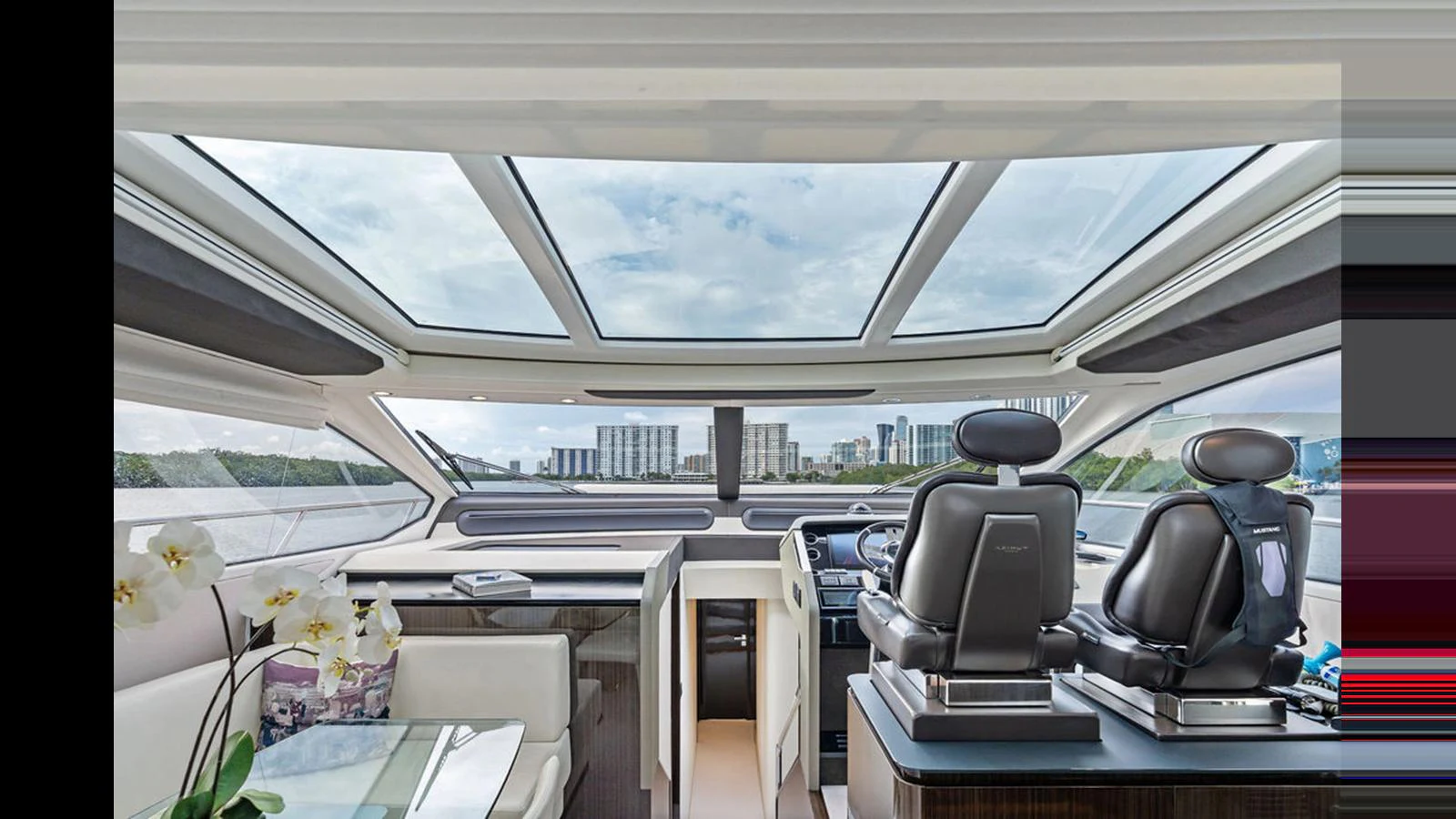 The helm area features modern seating and expansive windows for a panoramic view. aboard VILLAGGIO Yacht for Sale