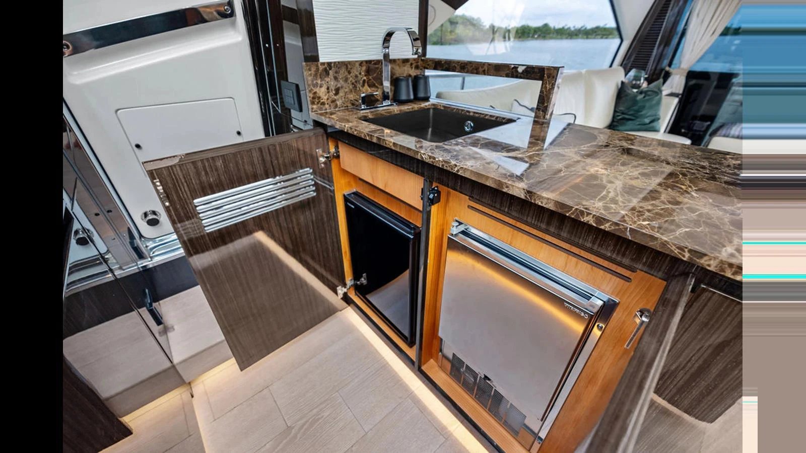The yacht's galley features modern appliances and a sleek marble countertop. aboard VILLAGGIO Yacht for Sale