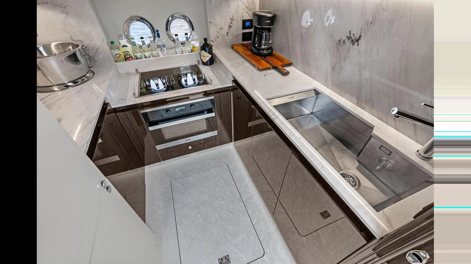 The galley features modern appliances and a sleek design, perfect for gourmet cooking at sea. aboard VILLAGGIO Yacht for Sale