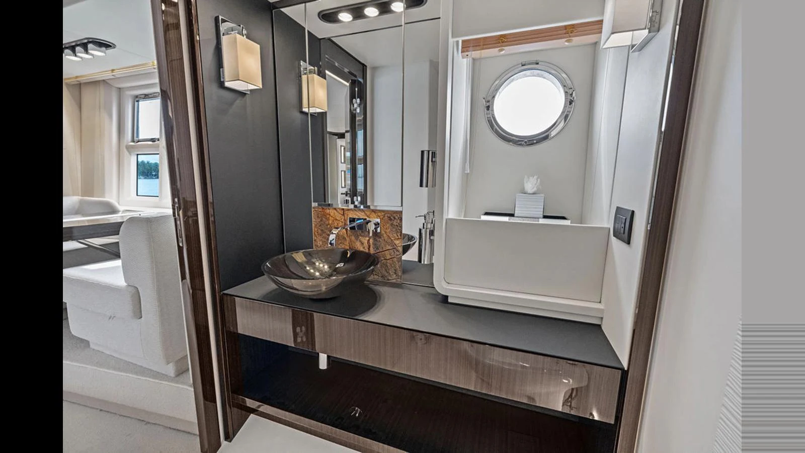 The yacht's bathroom features a sleek, modern design with a stylish sink and ample lighting. aboard VILLAGGIO Yacht for Sale