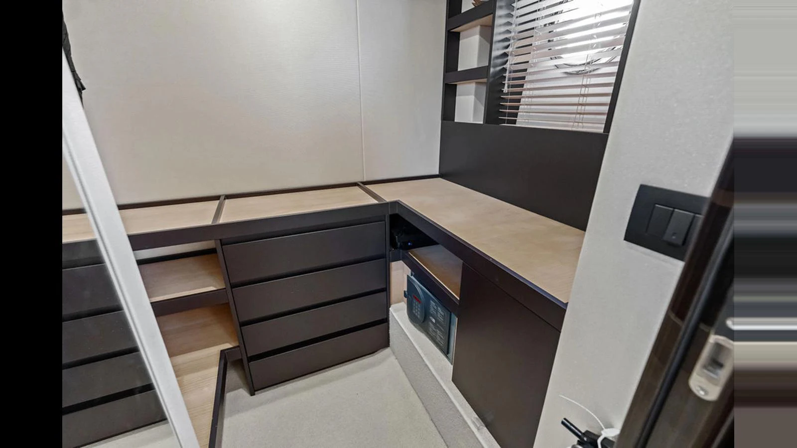A sleek and modern interior workspace with ample storage and clean lines. aboard VILLAGGIO Yacht for Sale