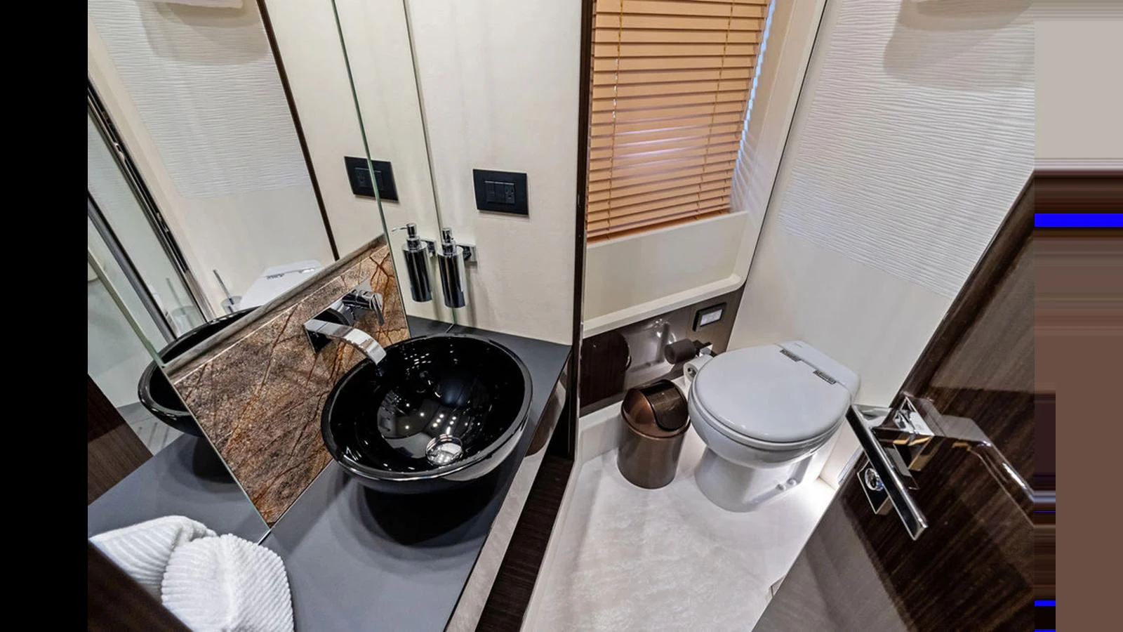 The yacht's bathroom features modern fixtures and elegant design. aboard VILLAGGIO Yacht for Sale