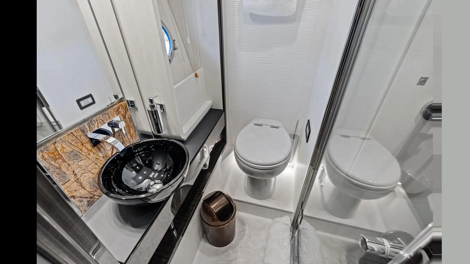 The yacht's bathroom features modern fixtures and elegant design. aboard VILLAGGIO Yacht for Sale
