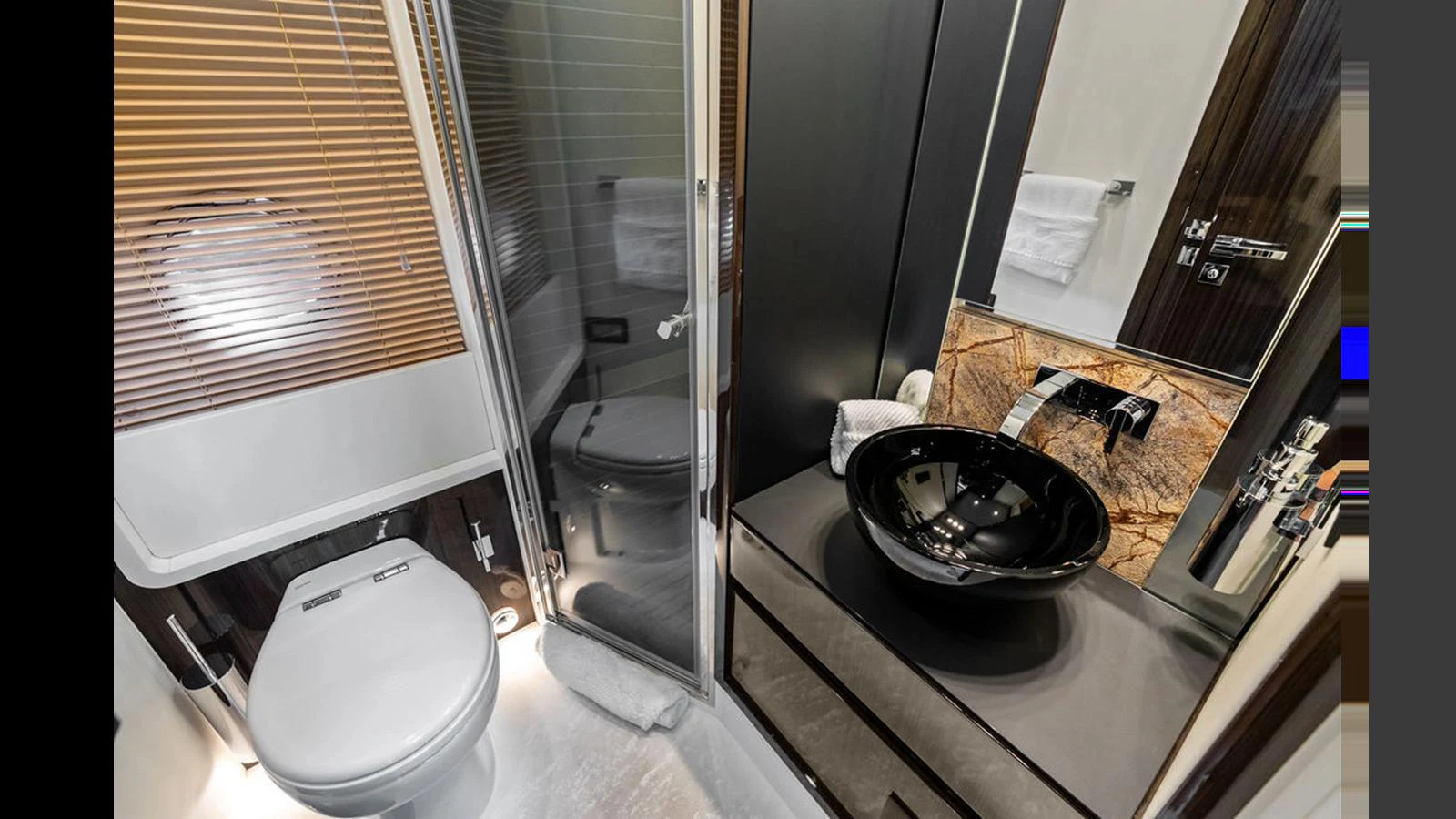 The yacht's bathroom features modern fixtures and elegant design. aboard VILLAGGIO Yacht for Sale