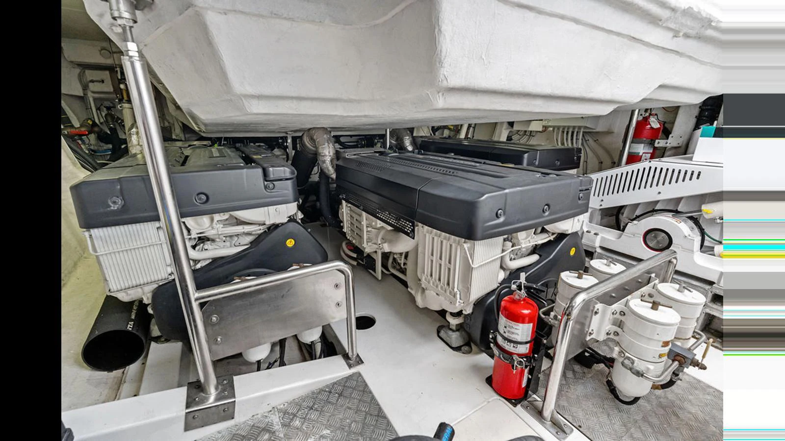 The yacht's engine room showcases powerful machinery and essential safety equipment. aboard VILLAGGIO Yacht for Sale
