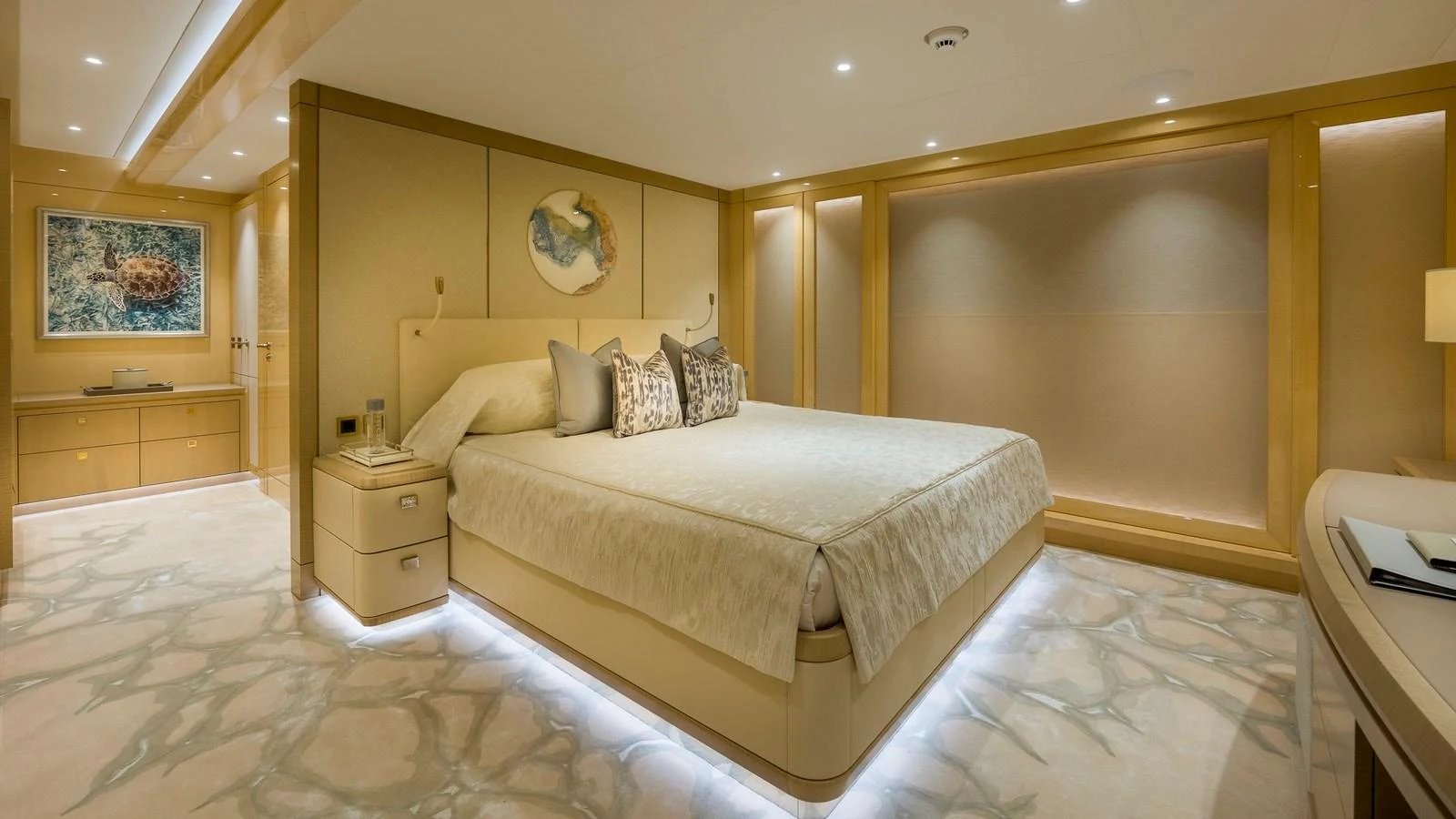 The master stateroom features a luxurious bed with elegant lighting and sophisticated decor. aboard NENINKA Yacht for Sale