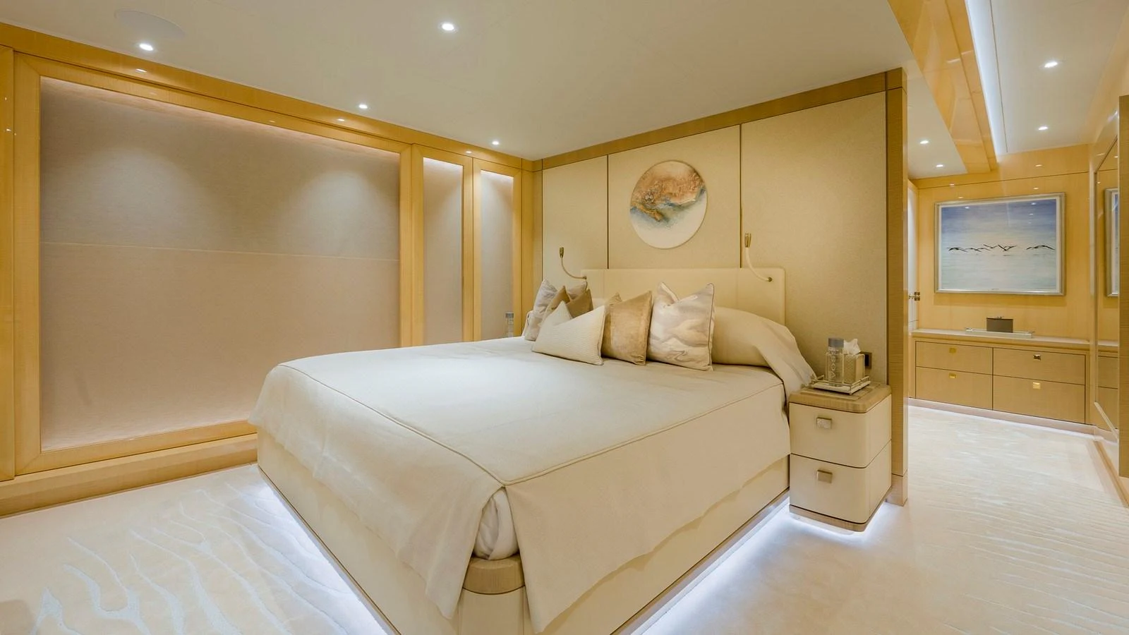 The master stateroom features a luxurious bed with elegant lighting and modern decor. aboard NENINKA Yacht for Sale