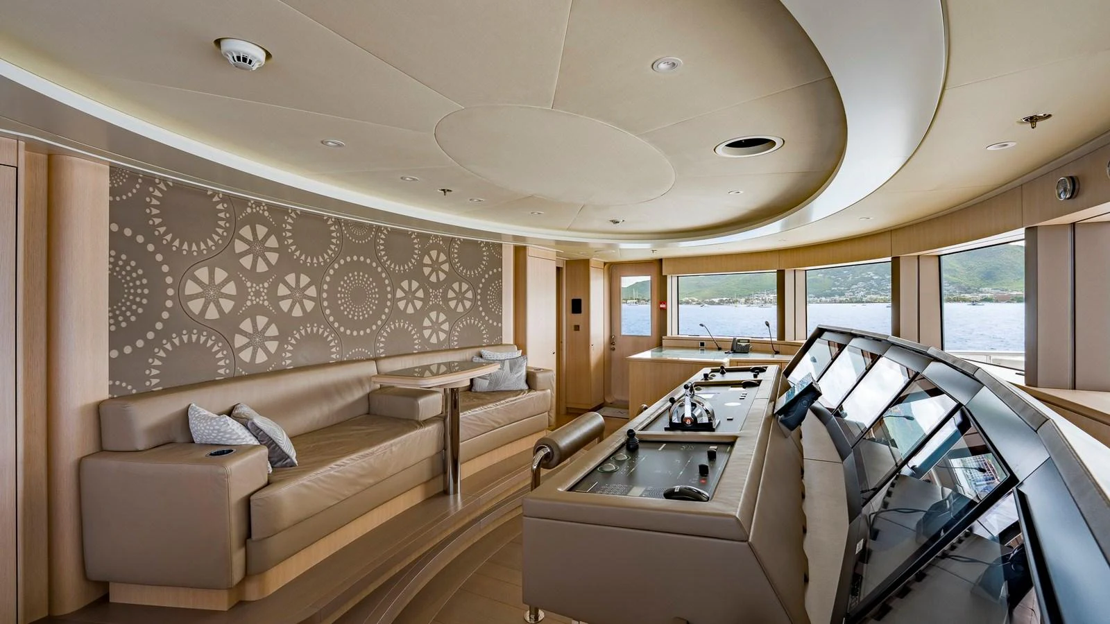 The helm station features a sleek design with comfortable seating and advanced navigation equipment. aboard NENINKA Yacht for Sale