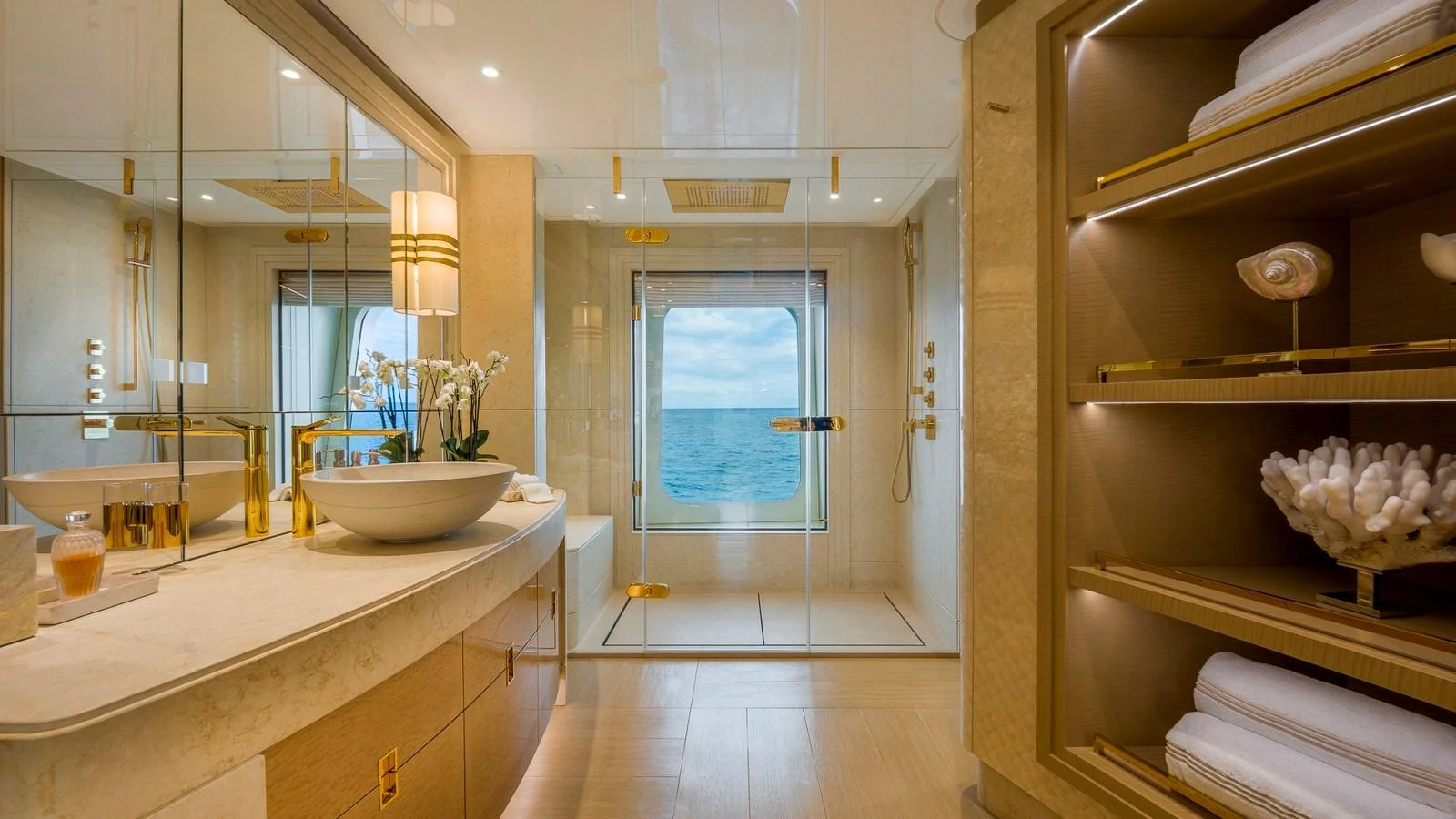 A luxurious yacht bathroom with a large window offering a stunning ocean view. aboard NENINKA Yacht for Sale