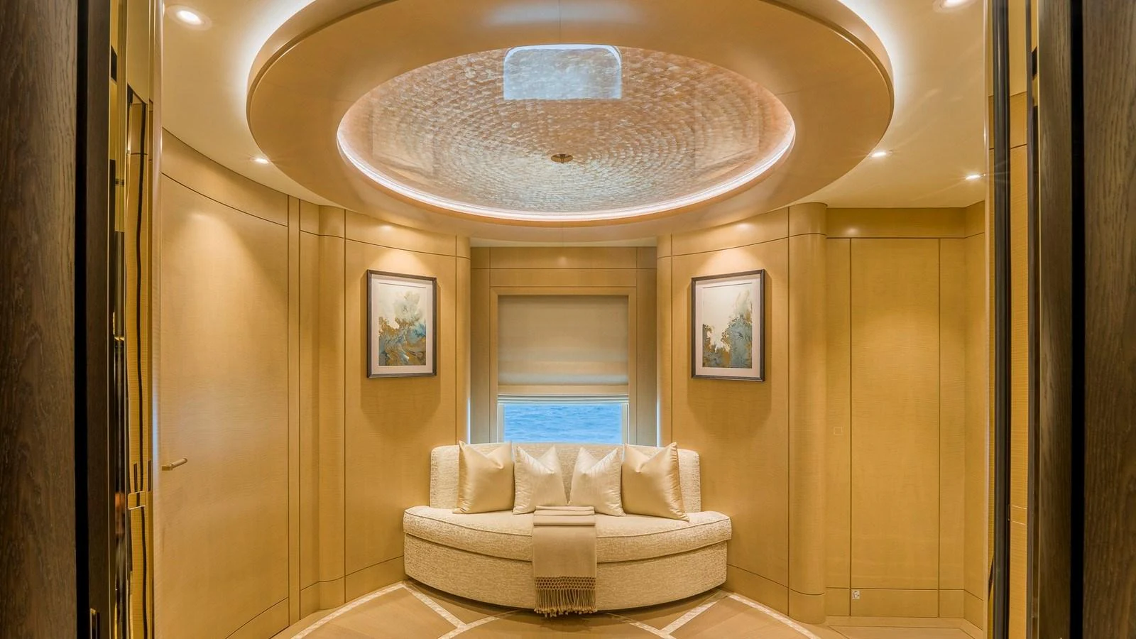 A luxurious seating area with elegant lighting and decor. aboard NENINKA Yacht for Sale