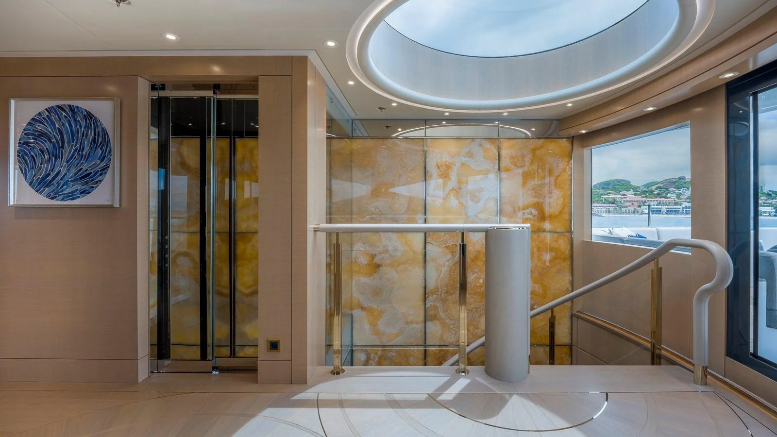 The yacht's interior features a stylish staircase with elegant lighting and modern decor. aboard NENINKA Yacht for Sale