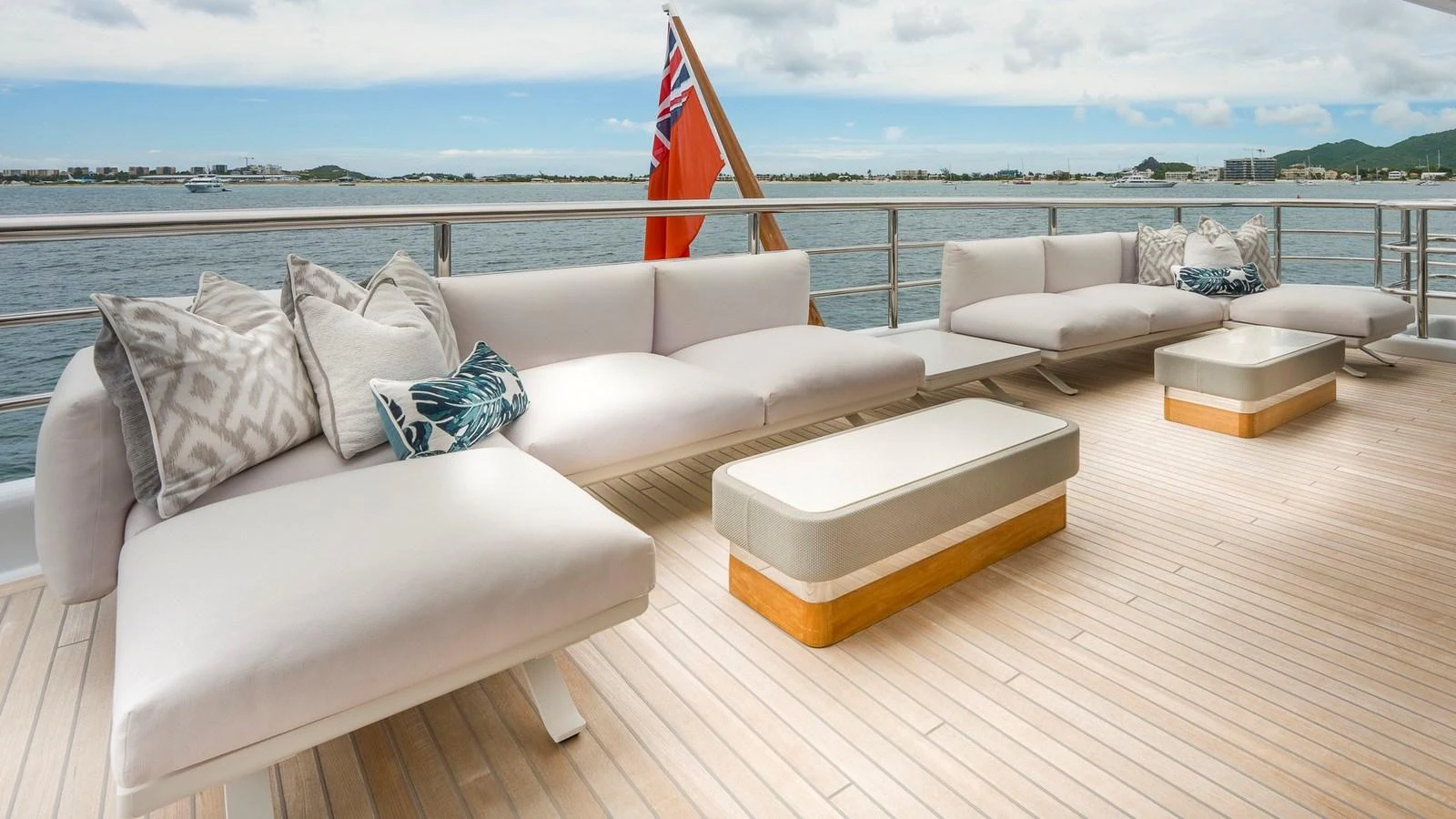 The aft deck features comfortable lounge seating with scenic ocean views. aboard NENINKA Yacht for Sale
