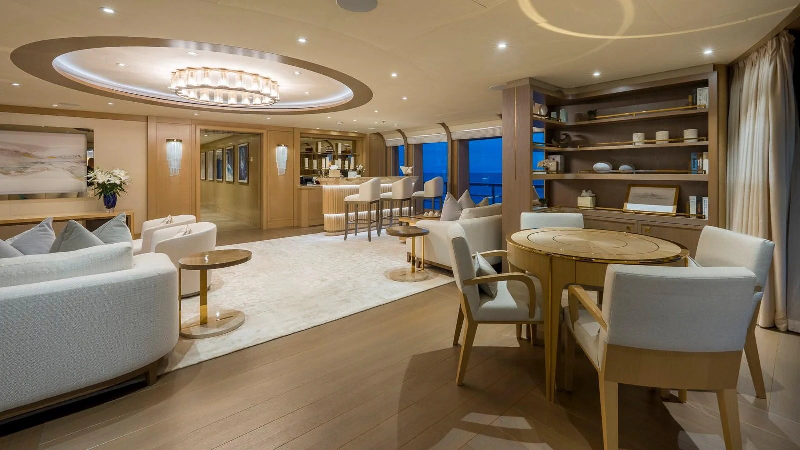 The yacht's salon features elegant seating, a bar area, and sophisticated decor. aboard NENINKA Yacht for Sale