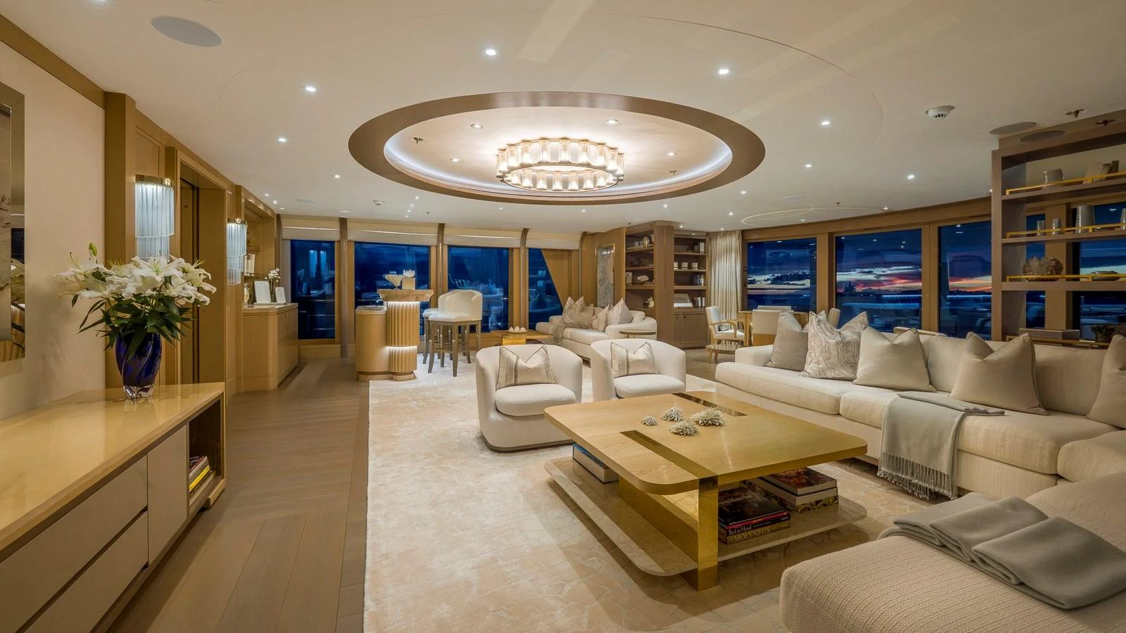 The salon features elegant furnishings and panoramic windows offering stunning views. aboard NENINKA Yacht for Sale