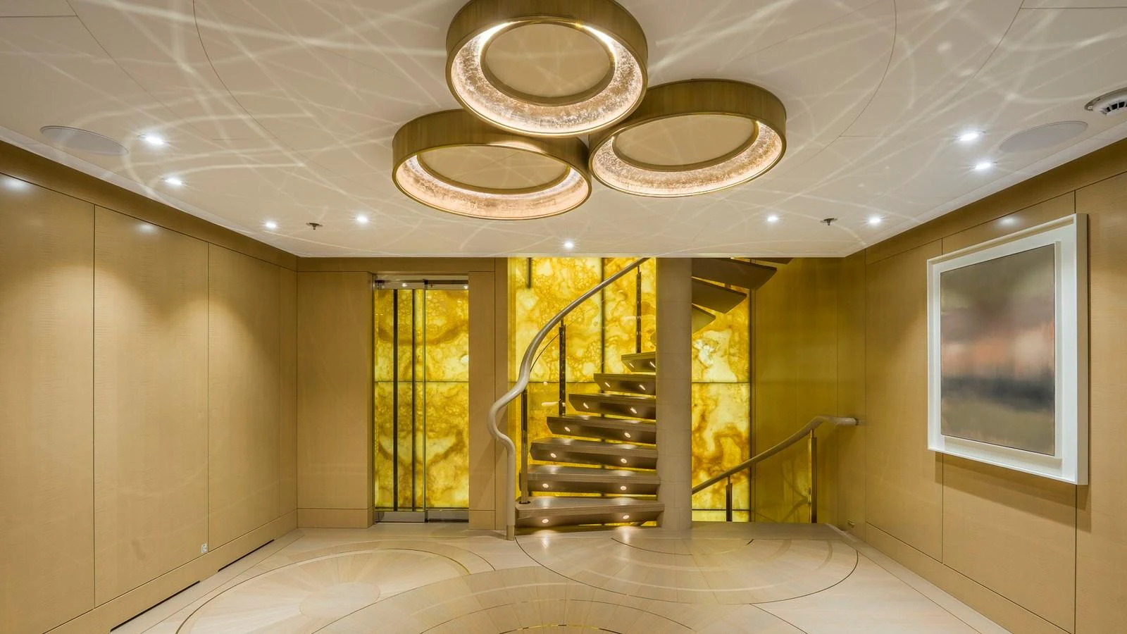 The yacht's interior features a stylish staircase with elegant lighting and modern design elements. aboard NENINKA Yacht for Sale